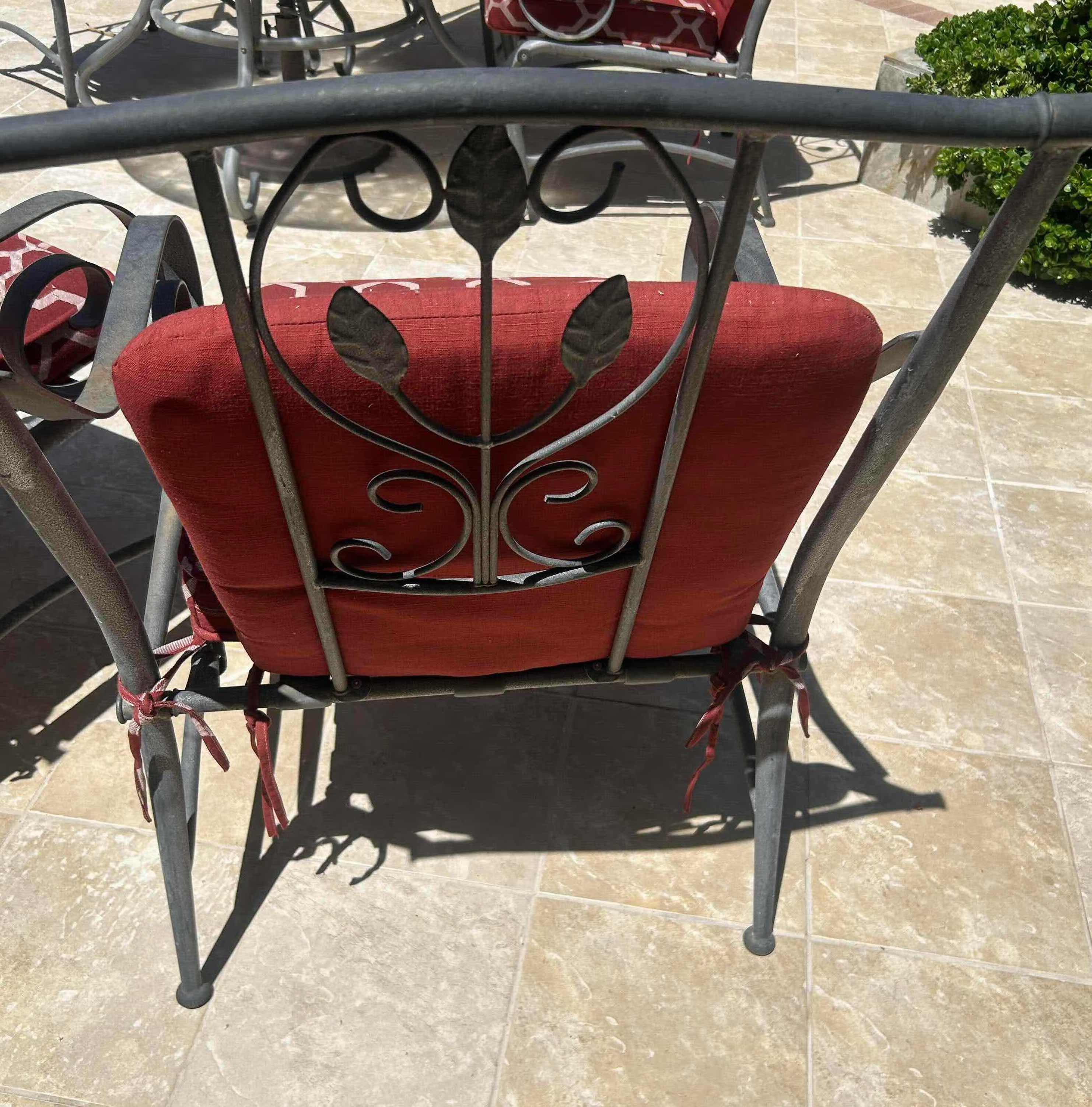 Photo 1 of RED GREY METAL OUTDOOR CHAIR W GEOMETRIC TRELLIS PATTERN ON CUSHIONS