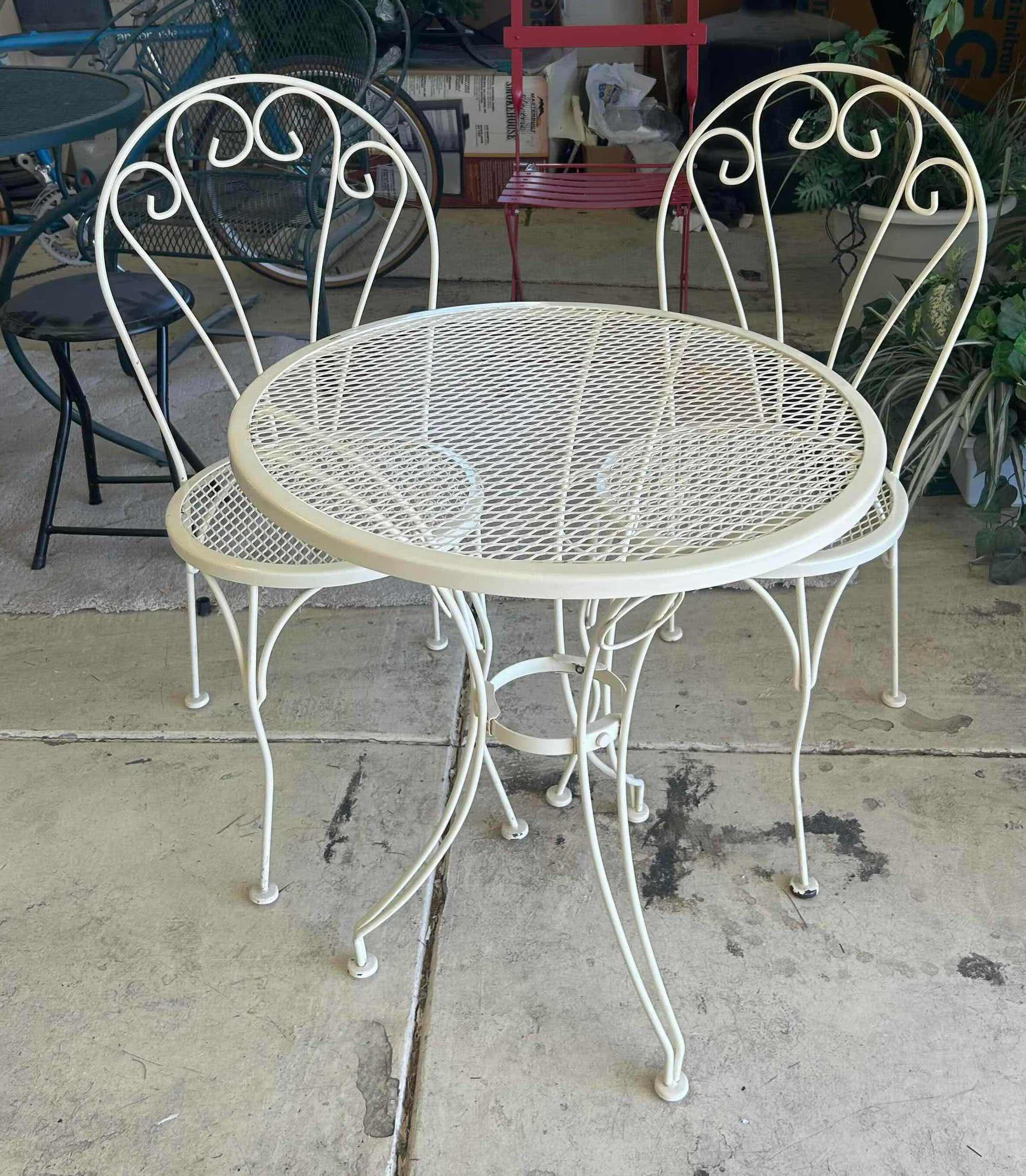Photo 1 of WHITE VINTAGE STYLE WROUGHT IRON BISTRO SET W 36" ROUND MESH PATTERN TABLE  & 2 MATCHING CHAIRS