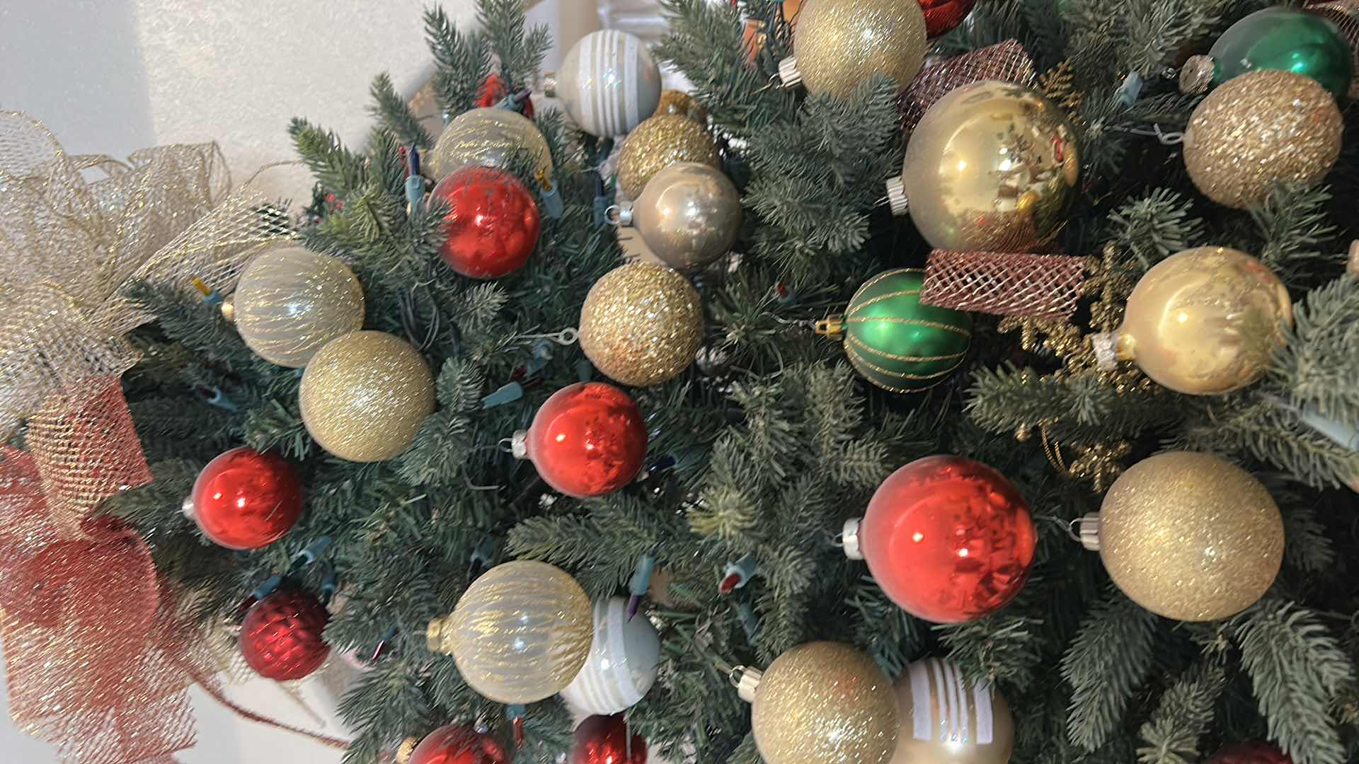 Photo 1 of 8’ ARTIFICIAL CHRISTMAS TREE DECORATED W RED GOLD WHITE GREEN ORNAMENTS