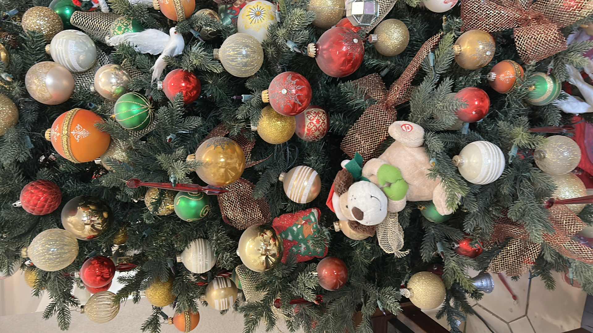 Photo 1 of 8’ ARTIFICIAL CHRISTMAS TREE DECORATED W RED GOLD WHITE GREEN ORNAMENTS
