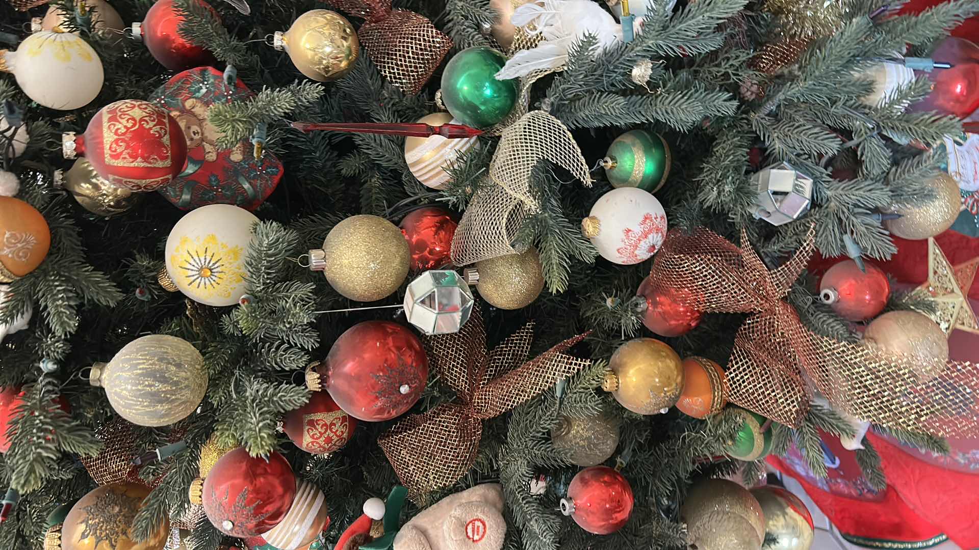 Photo 1 of 8’ ARTIFICIAL CHRISTMAS TREE DECORATED W RED GOLD WHITE GREEN ORNAMENTS
