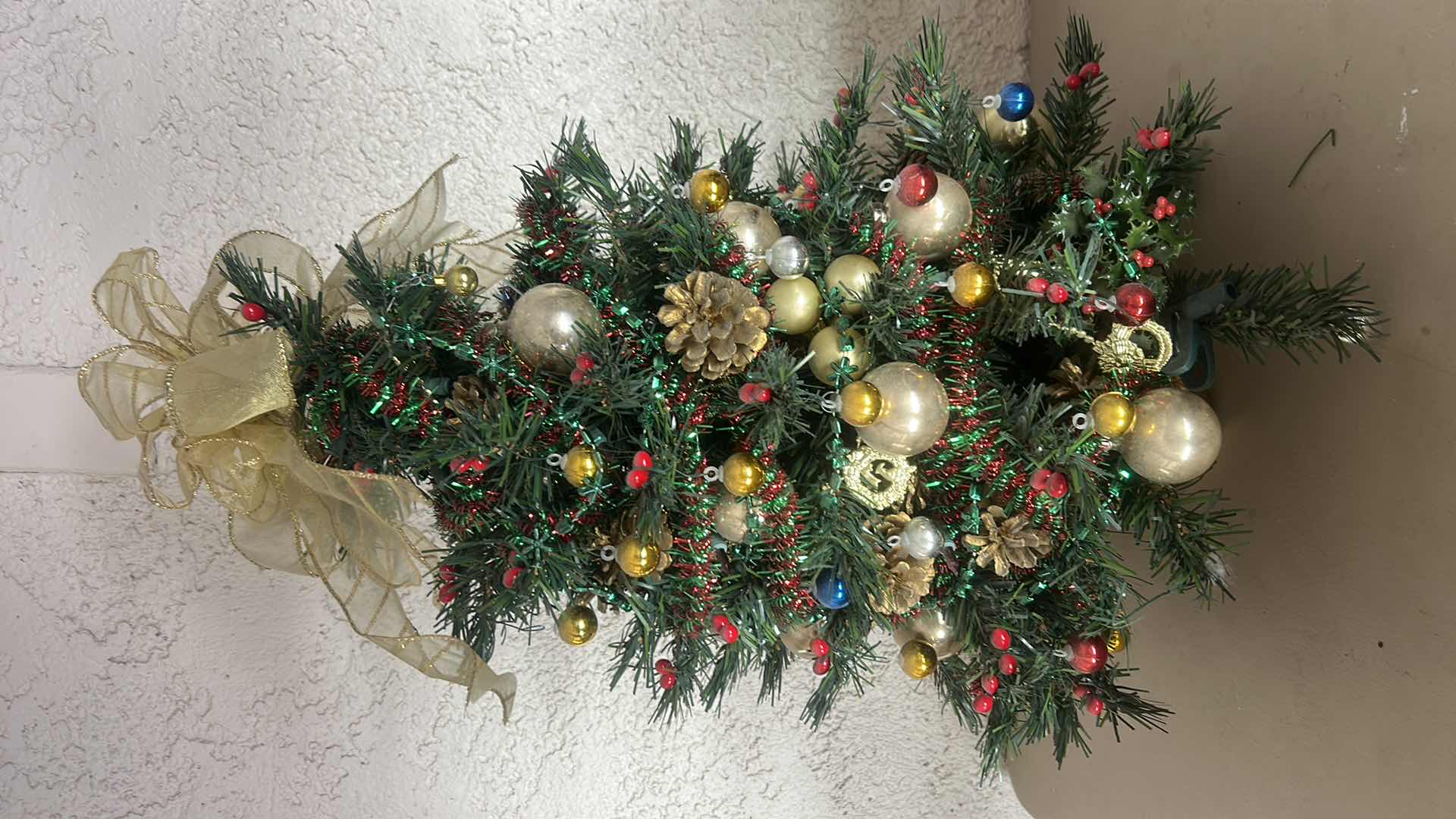 Photo 1 of DECORATED MINATURE CHRISTMAS TREE W GOLD RIBBON BOW H21”