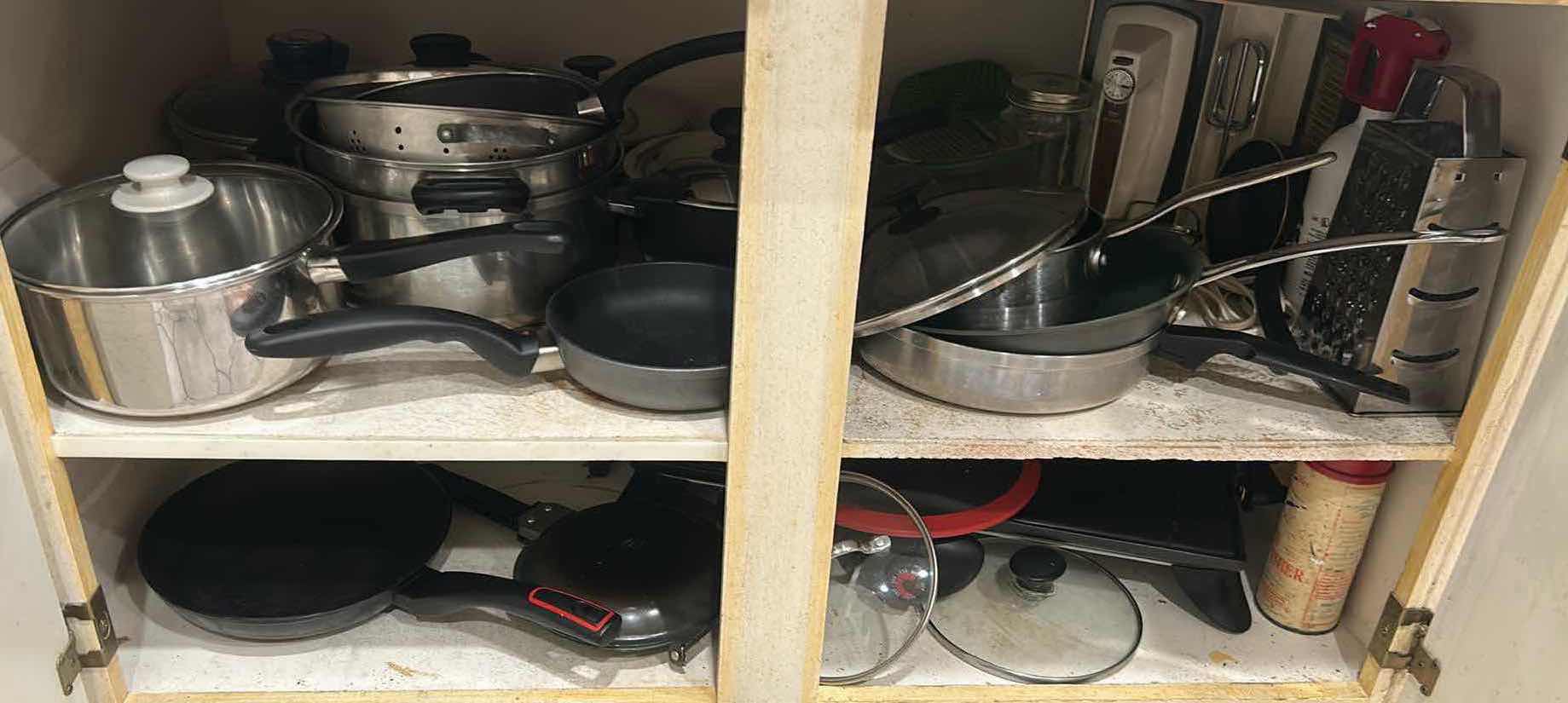 Photo 1 of CONTENTS OF CABINET POTS PANS