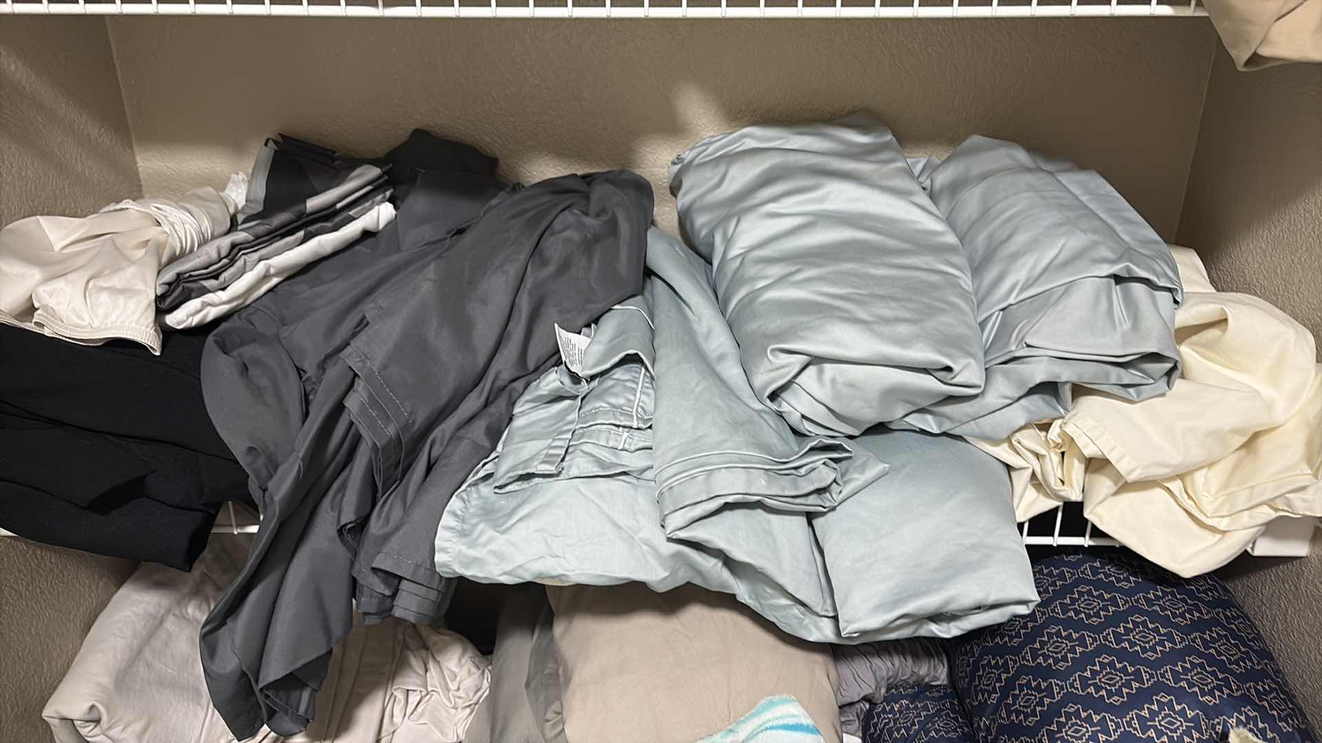 Photo 1 of CONTENTS OF PRIMARY BATHROOM LINEN CLOSET SIZE KING SHEETS, COMFORTERS, & MORE