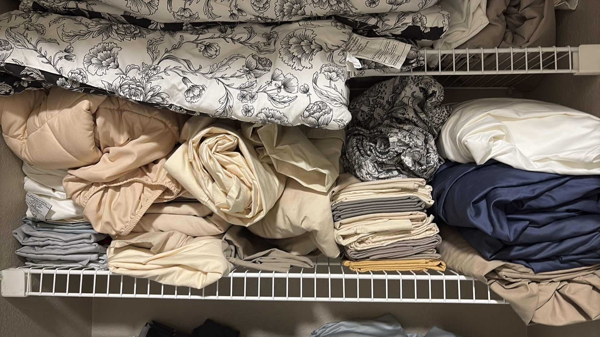 Photo 1 of CONTENTS OF PRIMARY BATHROOM LINEN CLOSET SIZE KING SHEETS, COMFORTERS, & MORE