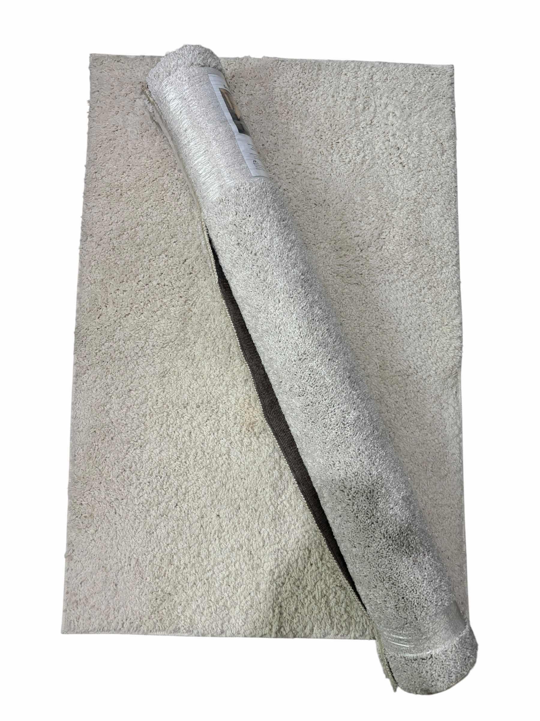 Photo 1 of TWO OFF WHITE RUGS: 4’ X 6’ & 30” X 46”