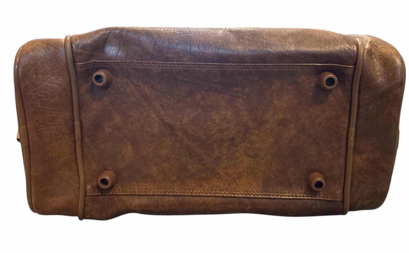 View 2 of VINTAGE AMERICAN TOURISTER BROWN FAUX LEATHER DUFFEL TRAVEL BAG WITH SHOULDER STRAP 16”X2”H10.5”