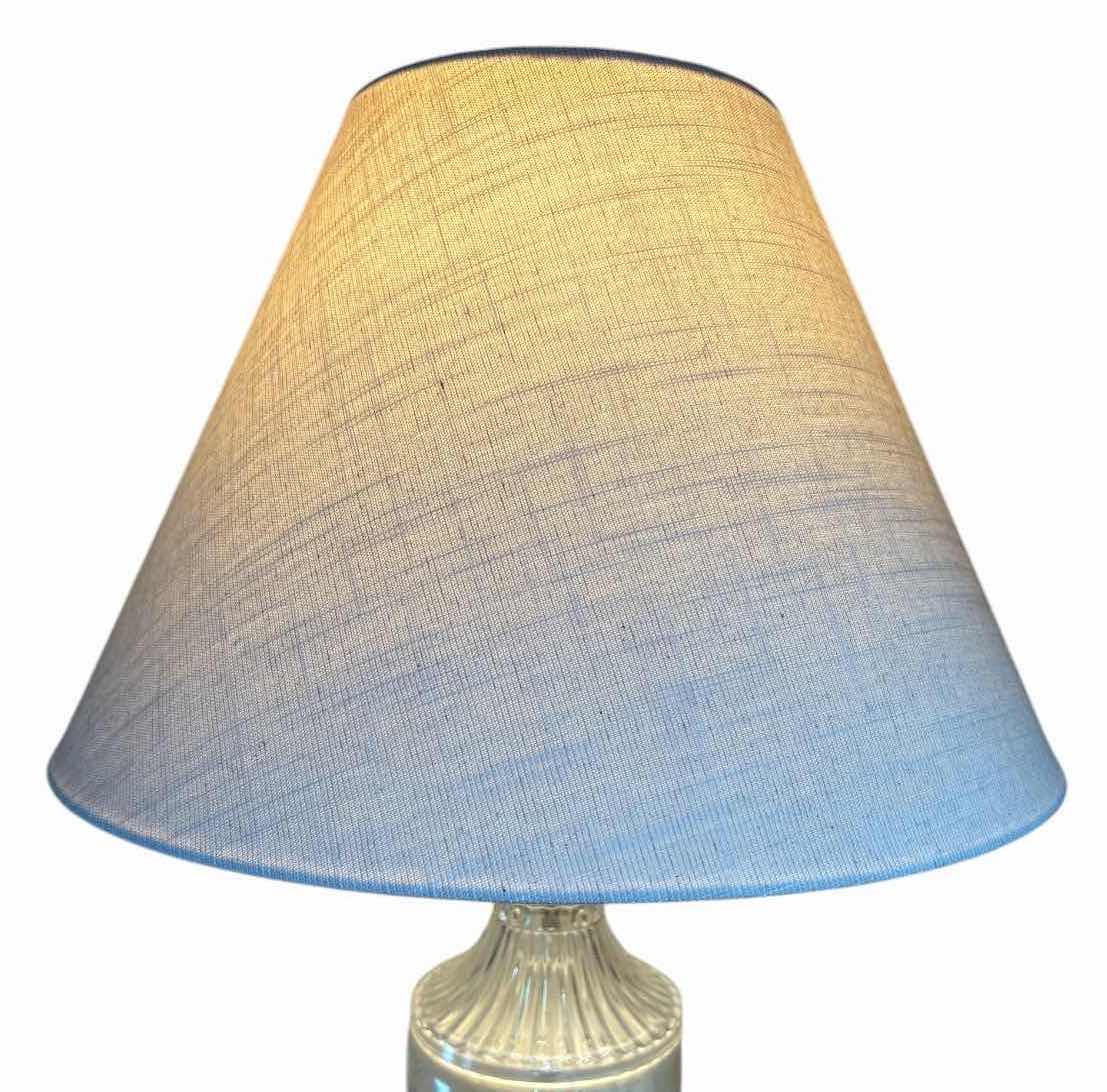 View 3 of CLEAR GLASS TABLE LAMP WITH GOLD TONE BASE & WHITE FABRIC SHADE H29” $60