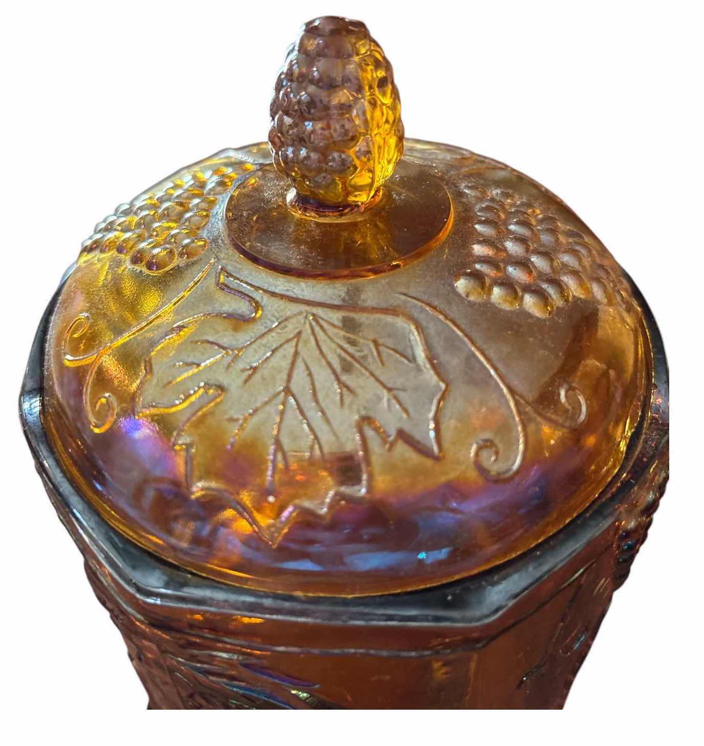 View 2 of IRIDESCENT CARNIVAL GLASS LIDDED CANISTER WITH EMBOSSED GRAPE & VINE DESIGN H8.5”