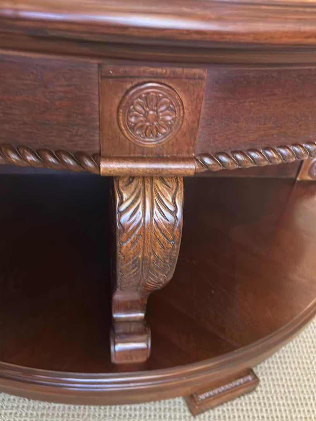 Photo 1 of MAHOGANY REEDED 41" ROUND SWIVEL  COCKTAIL TABLE W INTRICATE REEDING AROUND BASE H 23" SEE NOTES