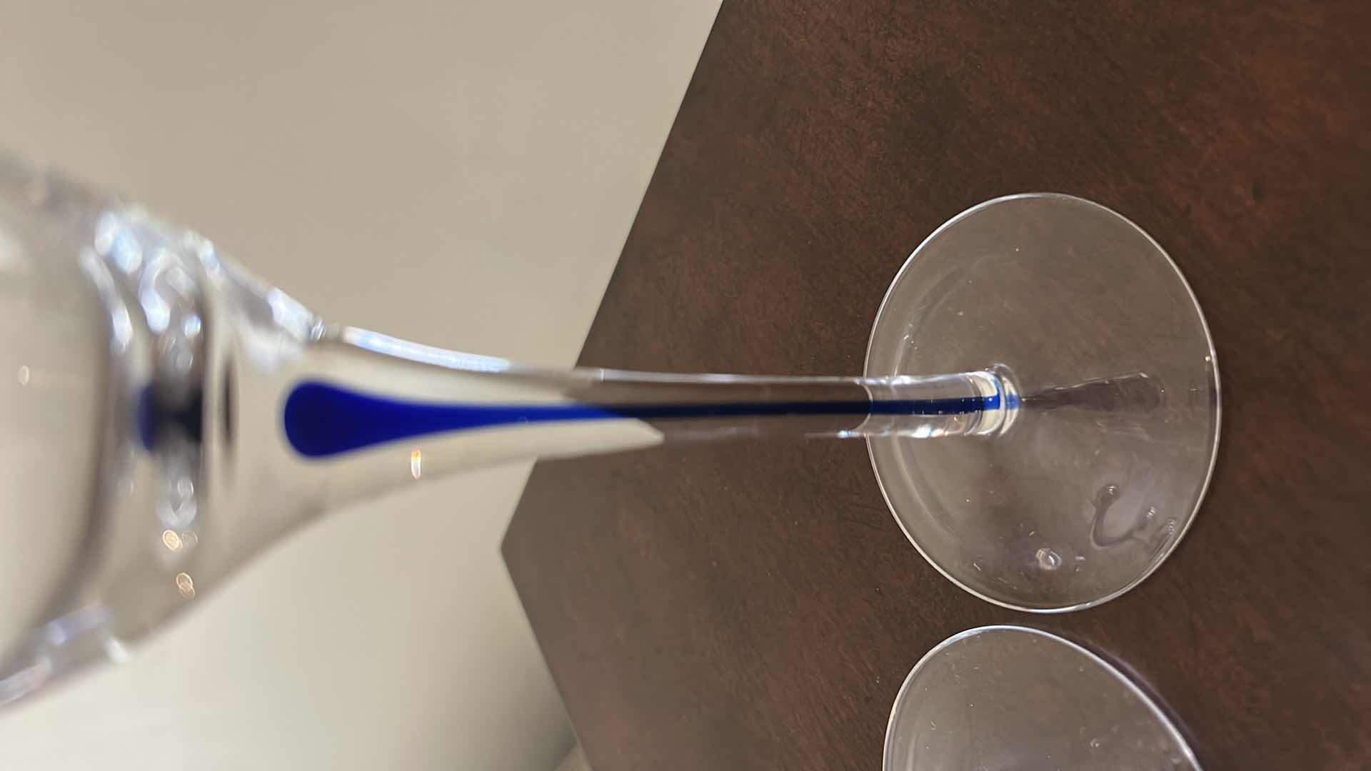 Photo 1 of 2- ORREFORS INTERMEZZO BLUE CHAMPAGNE FLUTES W BLUE TEARDROP SUSPENDED IN THE STEM