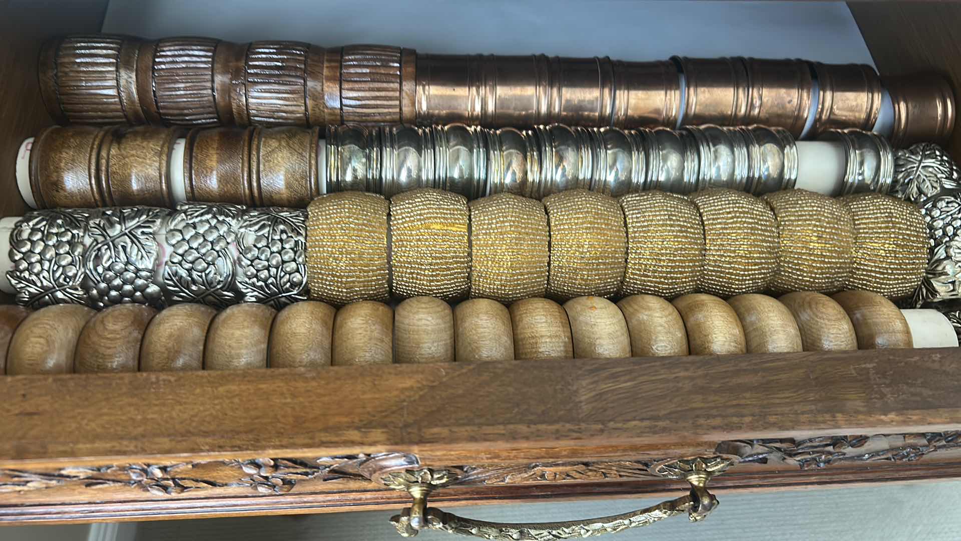 Photo 1 of CONTENTS OF DRAWER ASSORTMENT OF NAPKIN RINGS