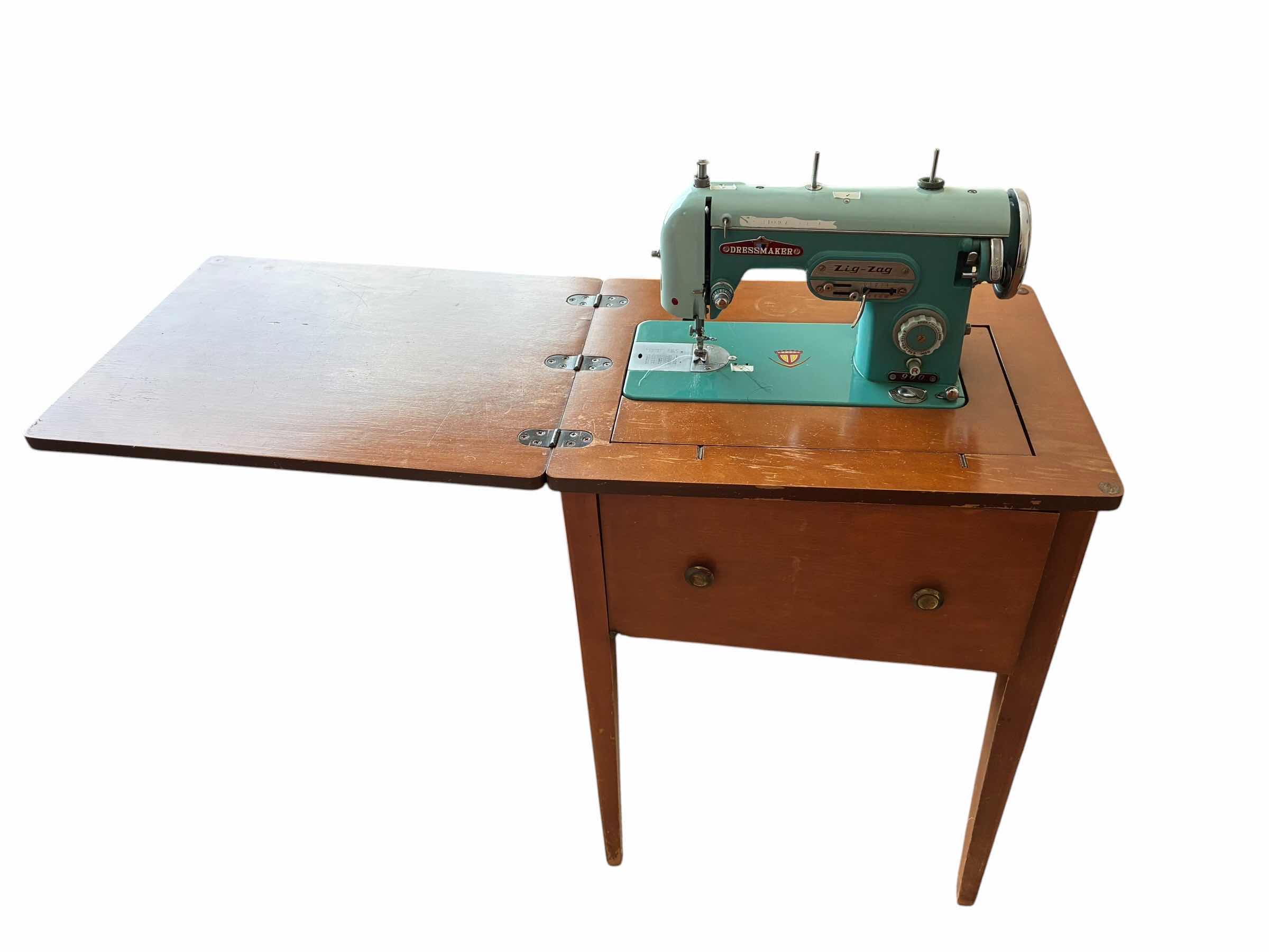 Photo 1 of DRESSMAKER ZIGZAG SEWING MACHINE 900 W WOOD STAND $350