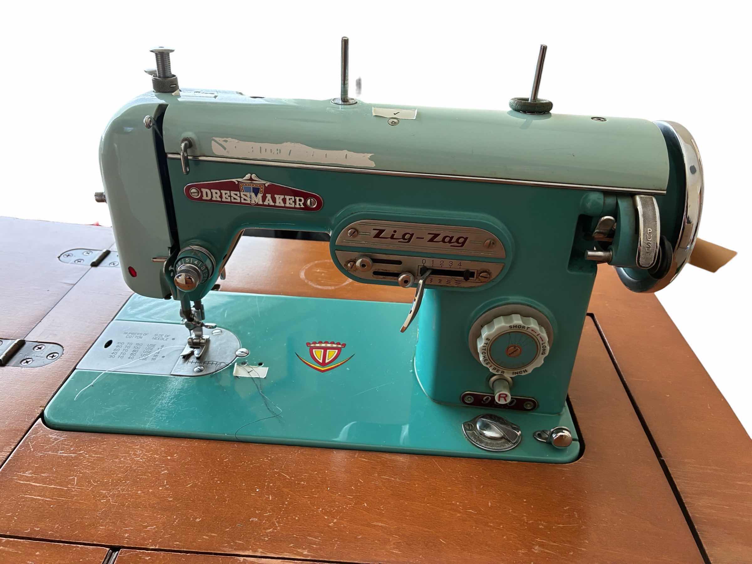Photo 1 of DRESSMAKER ZIGZAG SEWING MACHINE 900 W WOOD STAND $350