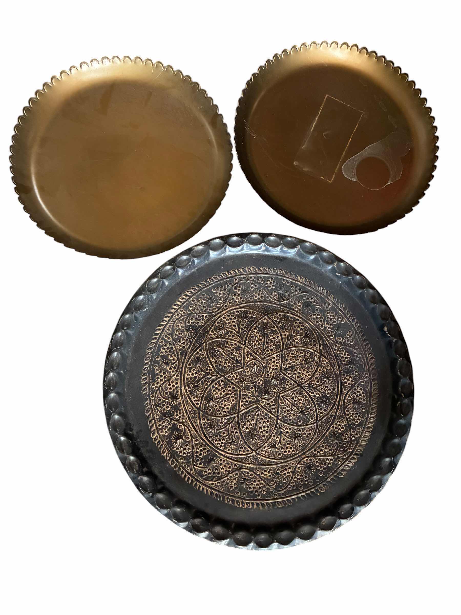 Photo 1 of VINTAGE DECORATIVE BRASS TONE ROUND TRAYS 17” & MID-CENTURY DECORATIVE AGED BLACK METAL TRAY 23“