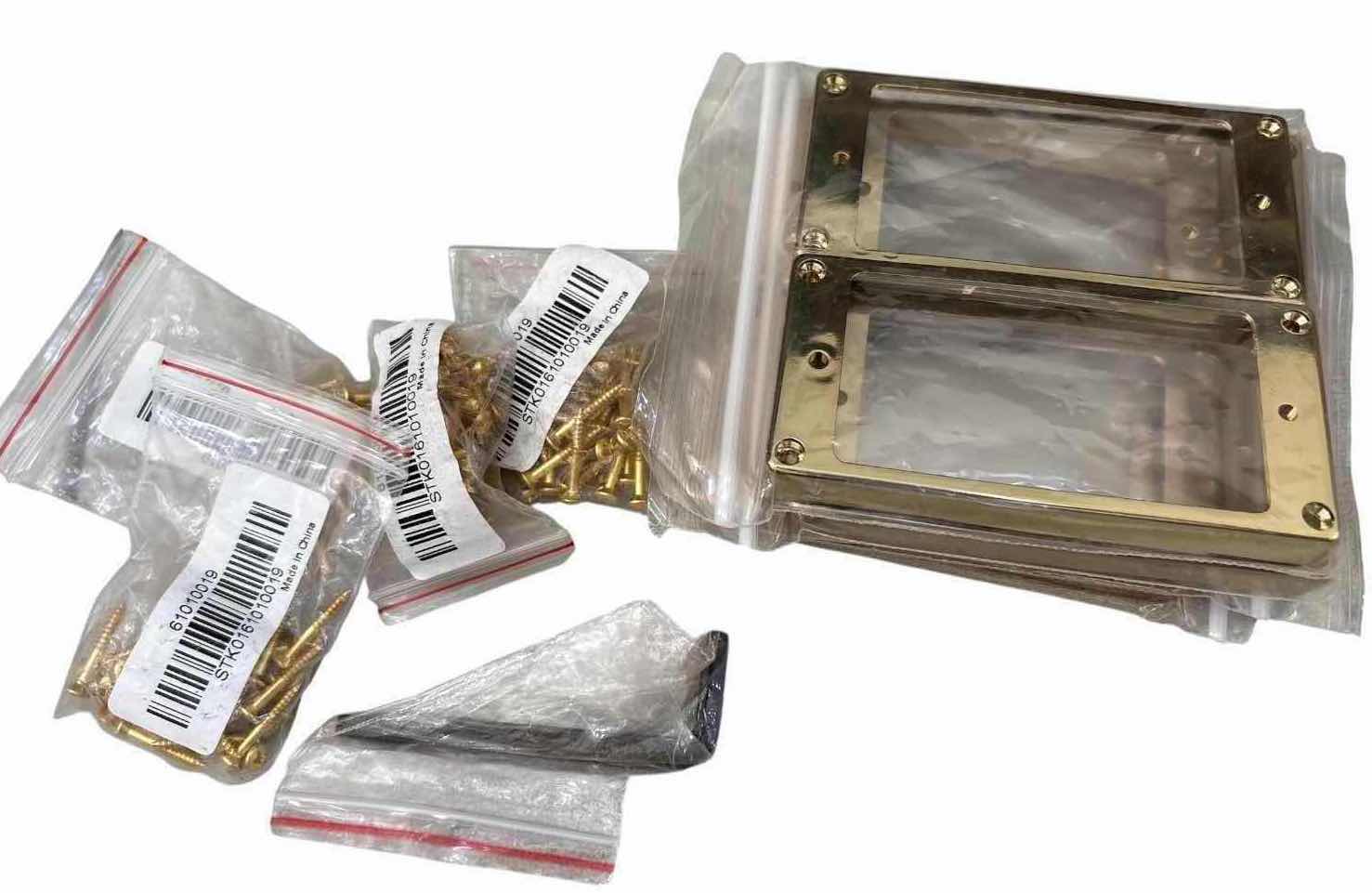 Photo 1 of ASSORTED GOLD-TONE & SMOKED HUMBUCKER GUITAR PICKUP MOUNTING RINGS W/ HARDWARE