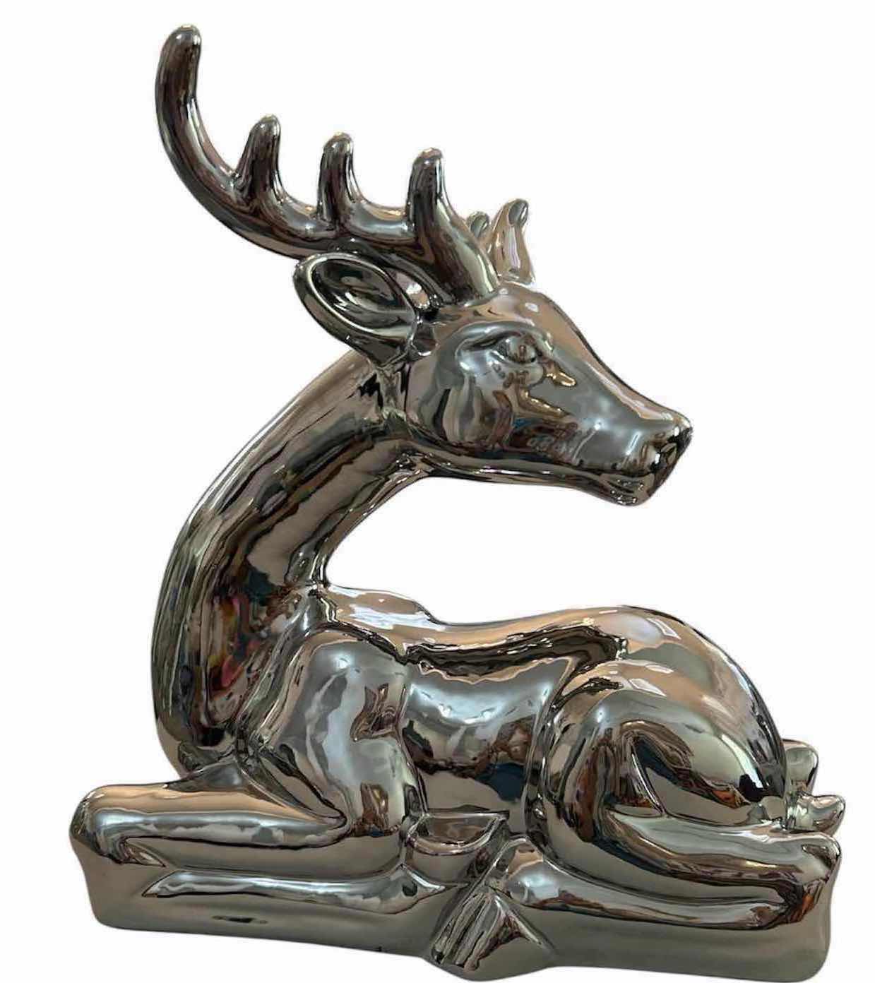 Photo 1 of PRECIOUS METAL SILVER TONED RESTING  DEER W REFLECTIVE METALLIC CHROME FINISH CURVED ANTLERS 15" X 15"