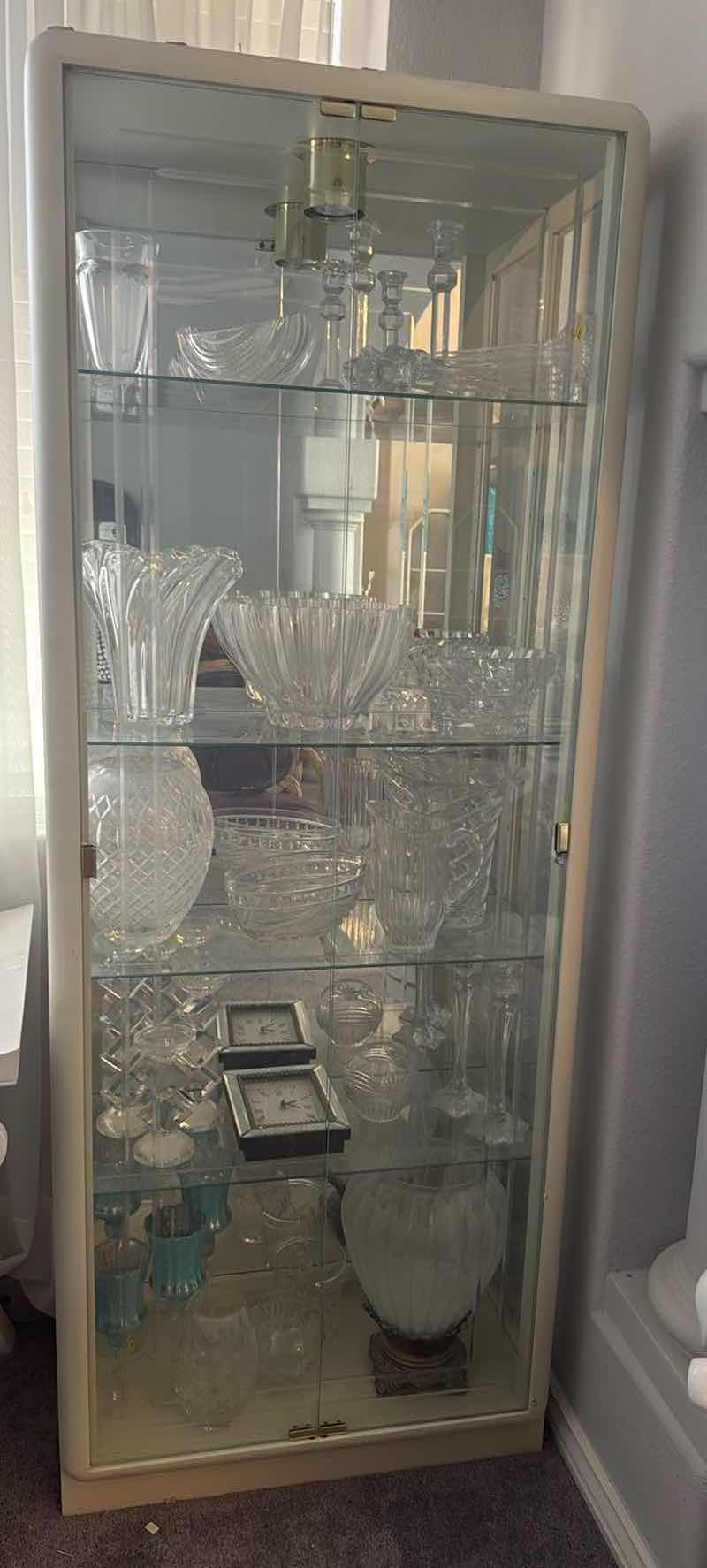 Photo 1 of LIGHTED BEVELED GLASS CURIO CABINET 29”x14” H78” (CONTENTS NOT INCLUDED)