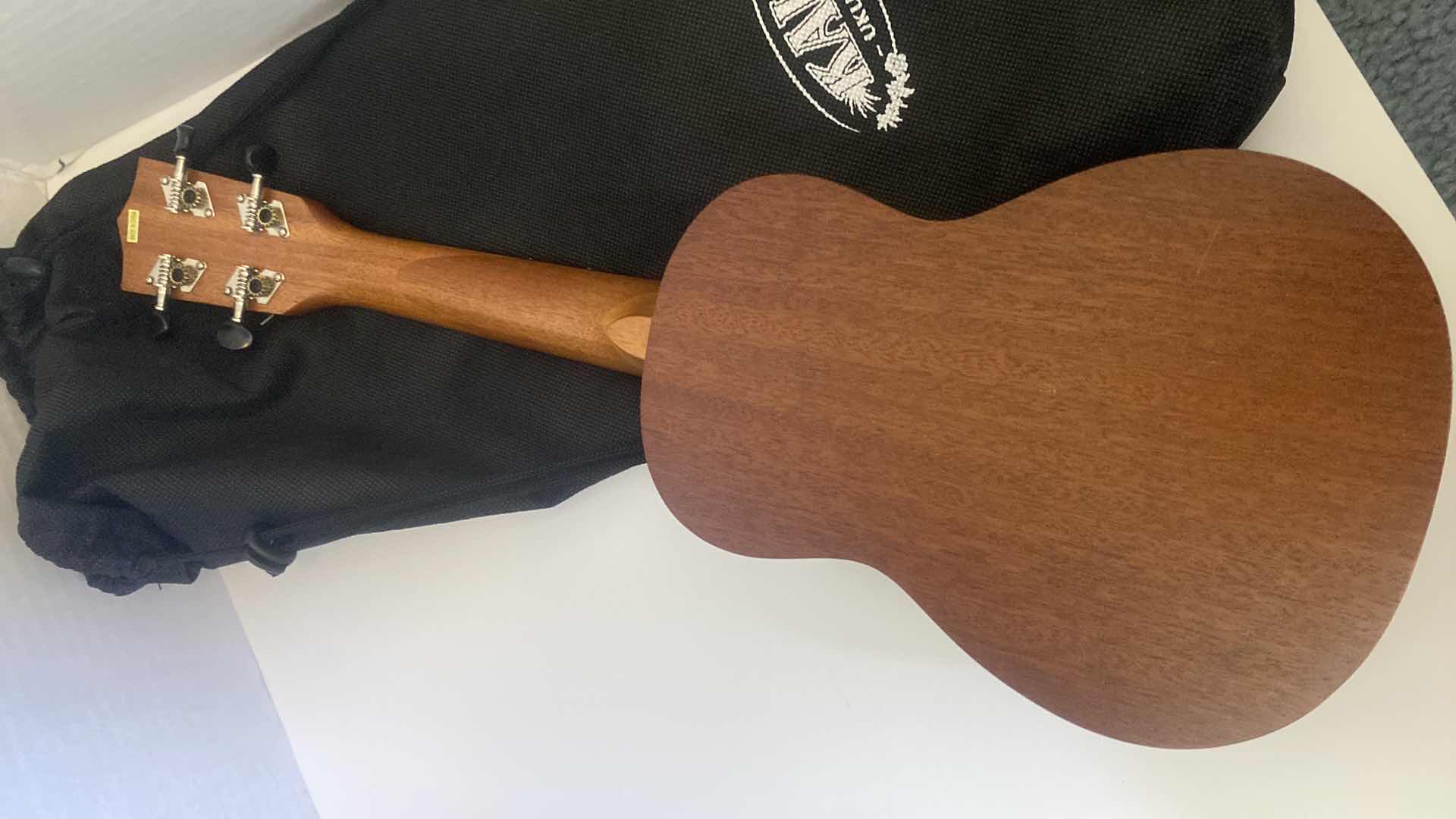 Photo 1 of WOOD CALLA UKULELE WITH STORAGE BAG