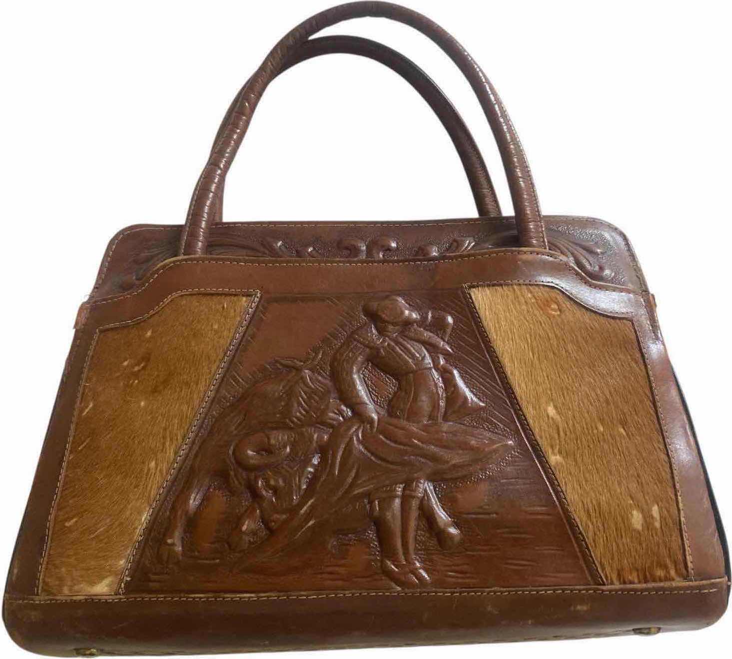 Photo 1 of VINTAGE WOMEN’S MONT-ABUR MEXICAN HAND TOOL LEATHER HANDBAG 12 1/2” X 4” EACH 8 1/2“ EXCLUDING HANDLES