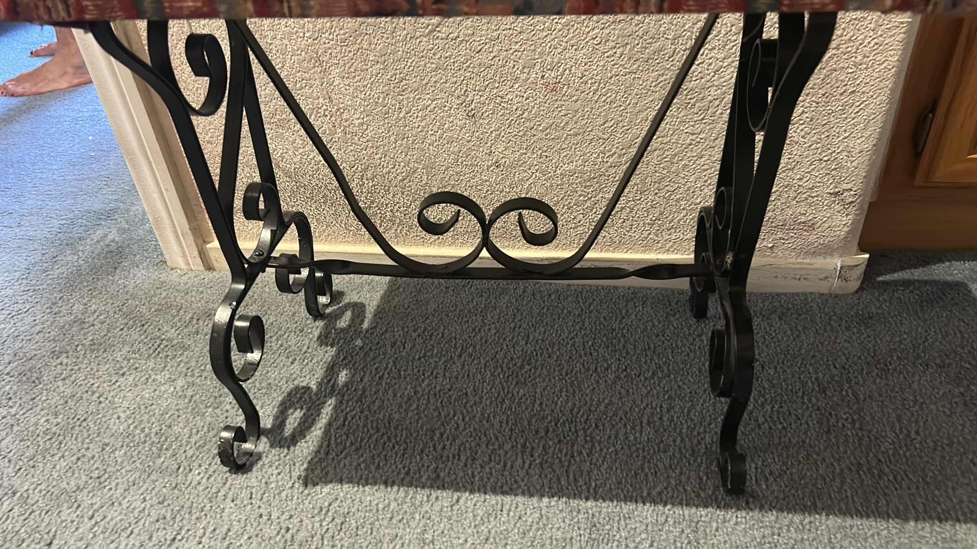 Photo 1 of SPANISH STYLE BENCH FEATURING BLACK SCROLL METAL LEGS AND UPHOLSTERED SEAT . 23” x 11 1/2” x H18 1/2”