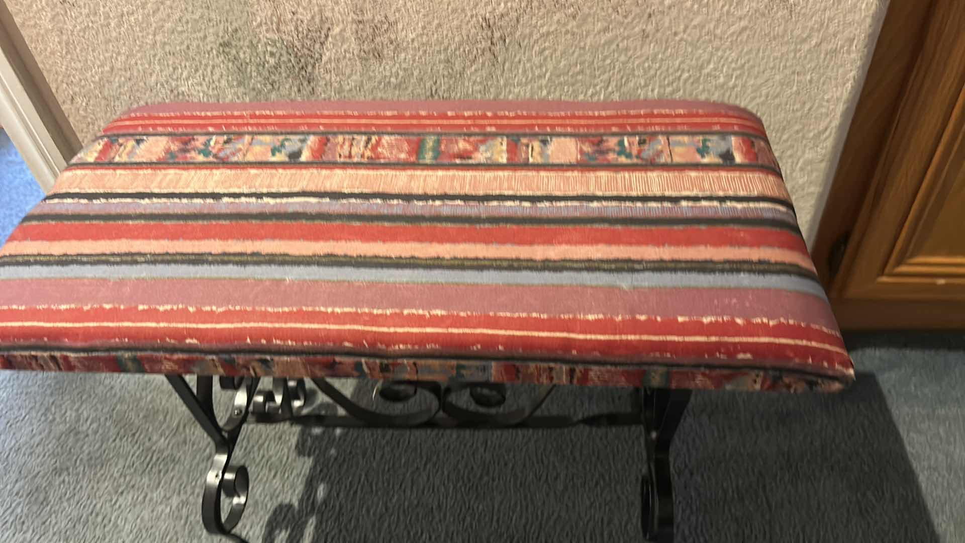 Photo 1 of SPANISH STYLE BENCH FEATURING BLACK SCROLL METAL LEGS AND UPHOLSTERED SEAT . 23” x 11 1/2” x H18 1/2”