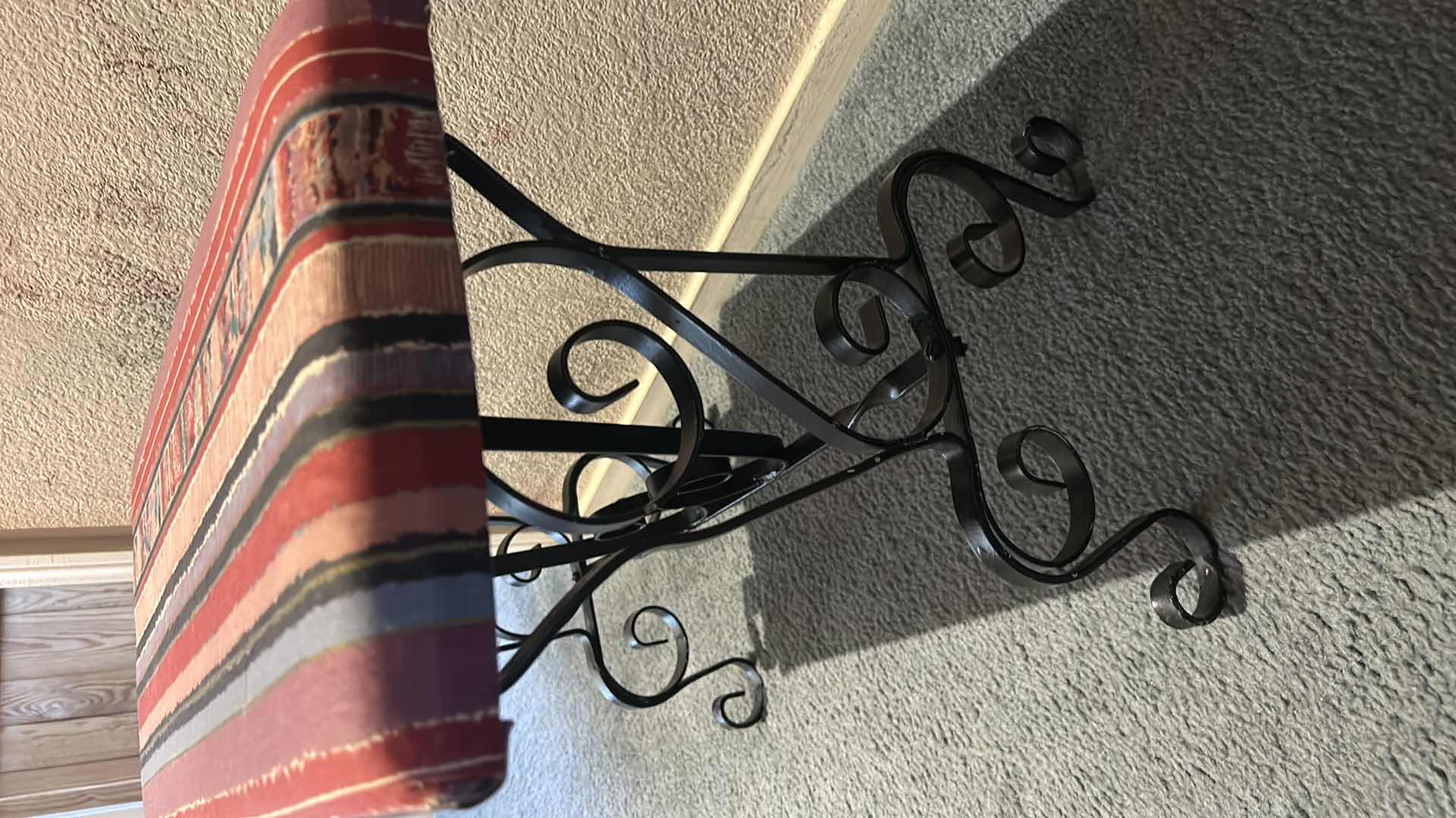 Photo 1 of SPANISH STYLE BENCH FEATURING BLACK SCROLL METAL LEGS AND UPHOLSTERED SEAT . 23” x 11 1/2” x H18 1/2”