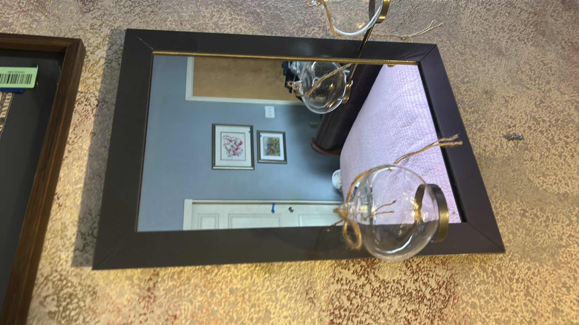 Photo 1 of WALL MIRROR FEATURING A MINIMALIST BLACK FRAME WITH CANDLE HOLDERS AND GLASS BULBS. 13” x H18”