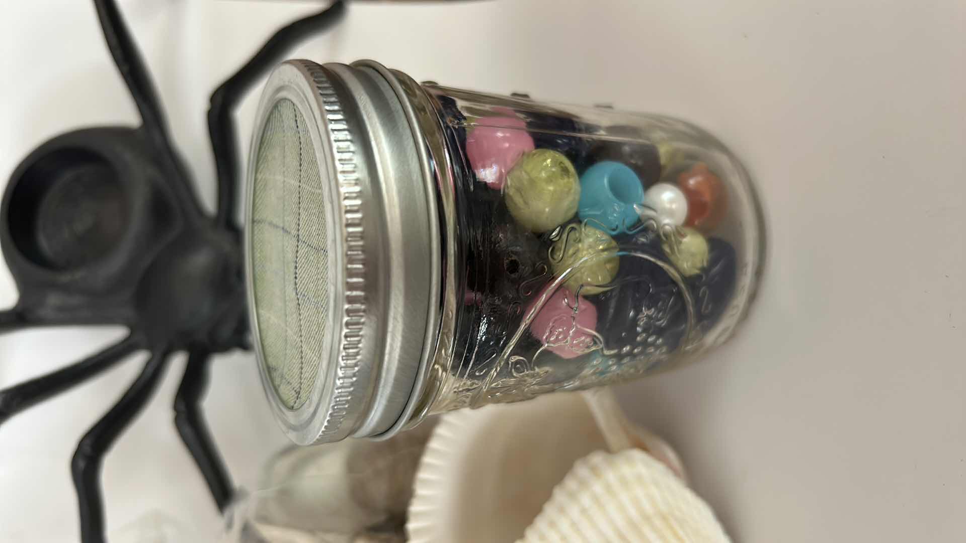 Photo 1 of MISCELLANEOUS HOME DECOR – MARBLES, SHELLS, COPPER BOWL, POLISHED ROCK, AND MORE