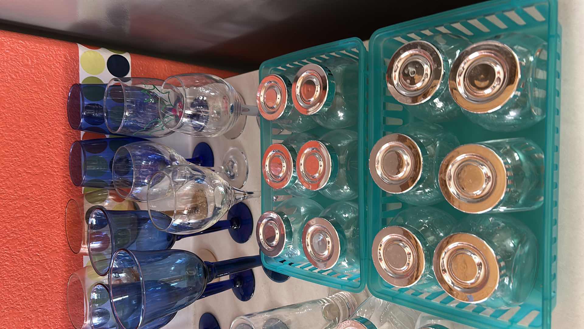 Photo 1 of COLLECTION FEATURING SEVERAL TYPES OF DRINKWARE, INCLUDING VINTAGE CRISTAR SKY BLUE RIOGA WINE, GLASSES AND STEMLESS, GOLDEN NUGGET BRANDED TUMBLERS ARE