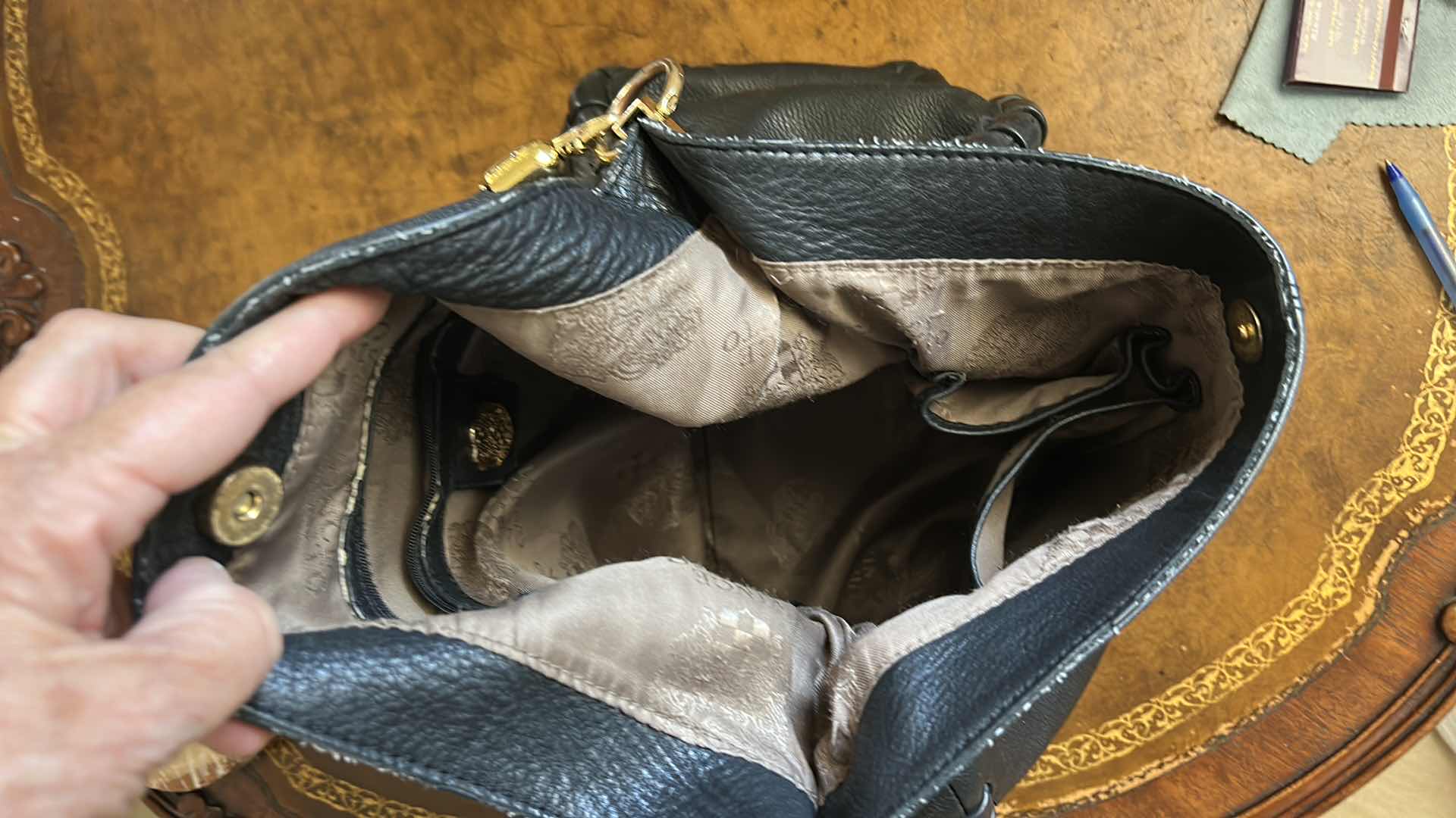Photo 1 of VINCE CAMUTO, BLACK LEATHER, WHIPSTITCH HOBO BAG.  $100