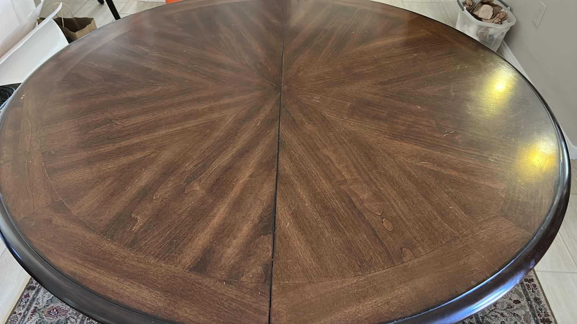 Photo 1 of MAHOGANY ROUND PEDESTAL DINING TABLE WITH DISTINCTIVE STARBURST VENEER PATTERN ON THE TOP AND A BLACK EBONIZED BASE. 4’ x 30” W/ 19”  LEAF