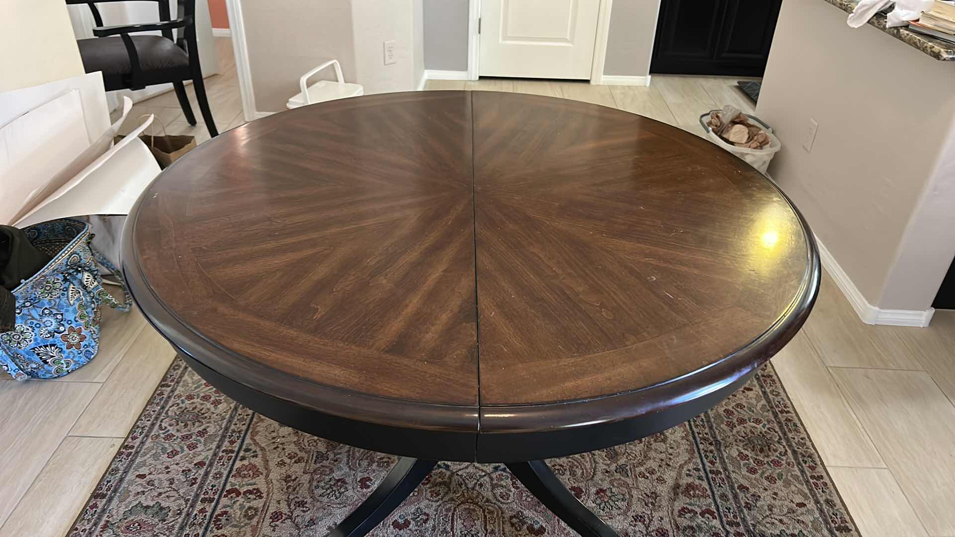 Photo 1 of MAHOGANY ROUND PEDESTAL DINING TABLE WITH DISTINCTIVE STARBURST VENEER PATTERN ON THE TOP AND A BLACK EBONIZED BASE. 4’ x 30” W/ 19”  LEAF