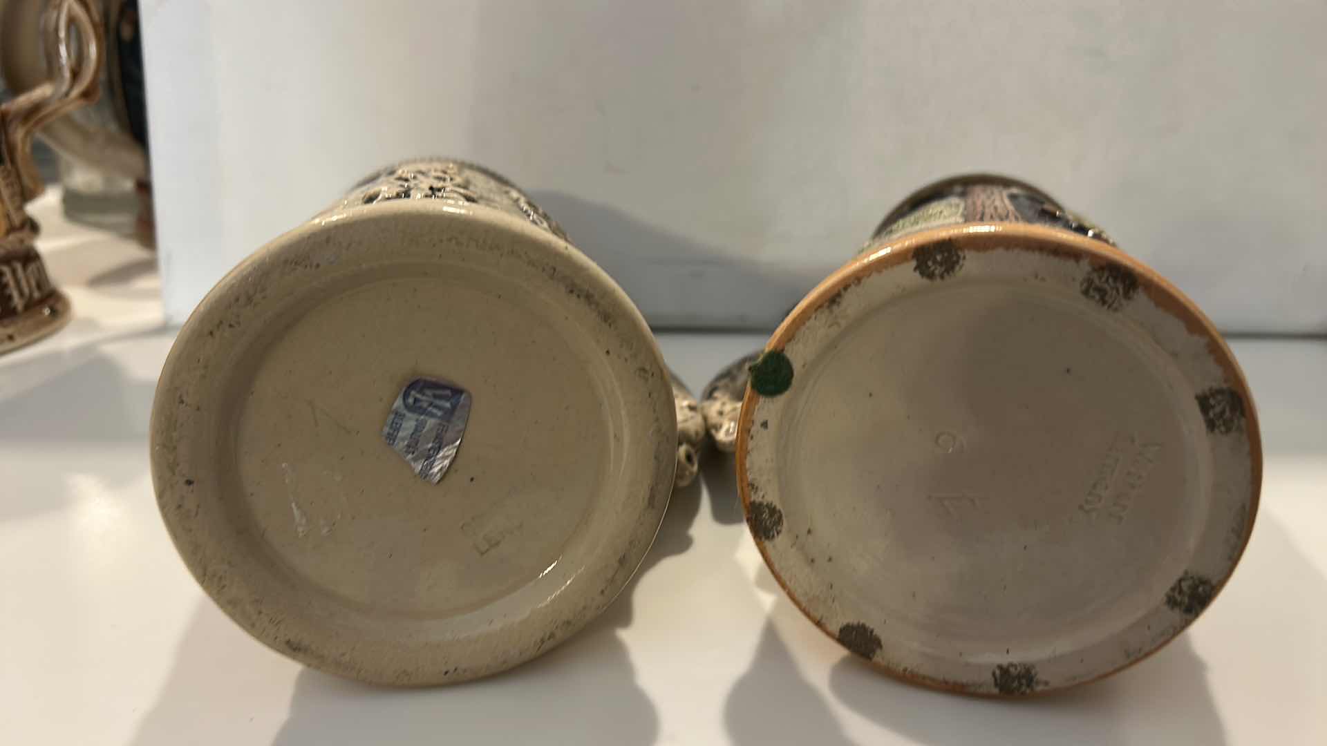 Photo 1 of 2 GERMAN & W GERMAN CERAMIC BEER STEINS