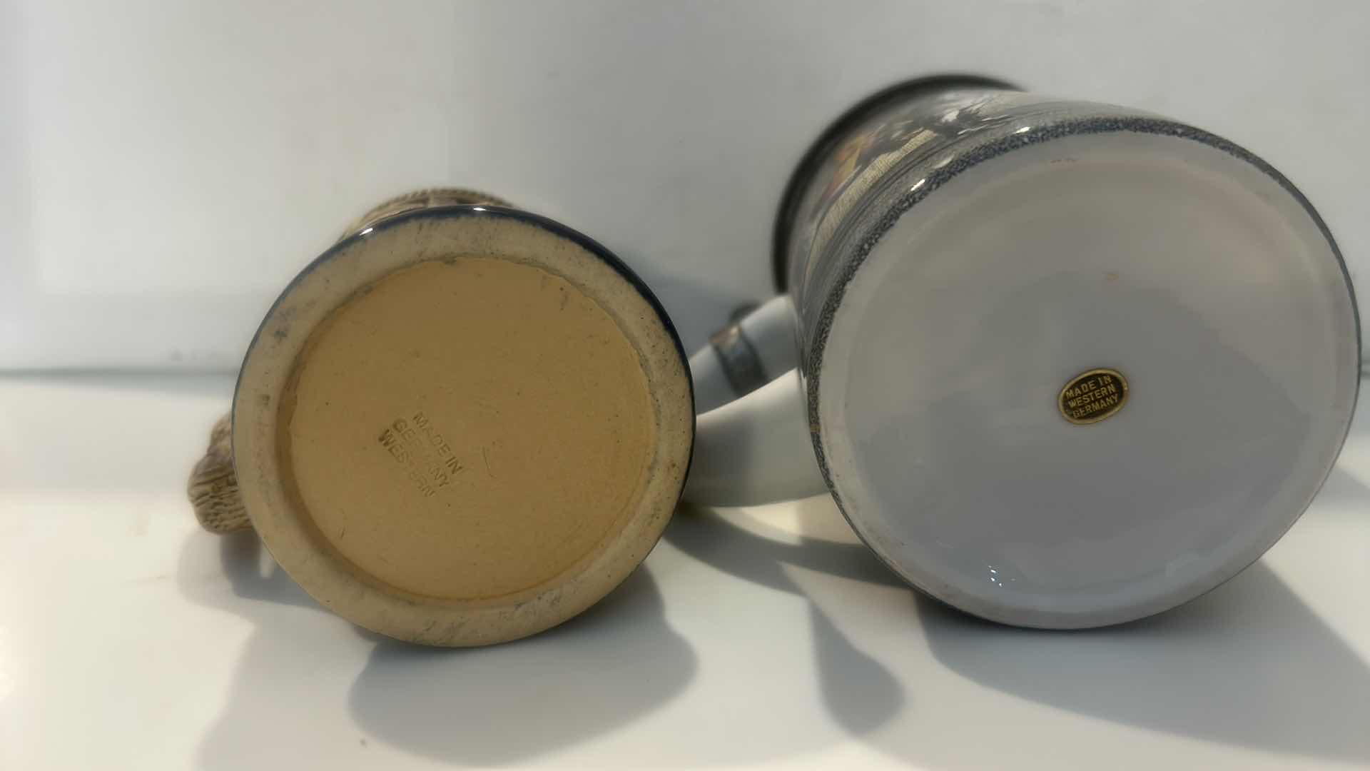 Photo 1 of 2  VINTAGE WEST GERMAN CERAMIC BEER STEINS ( TALLEST H7.5”)