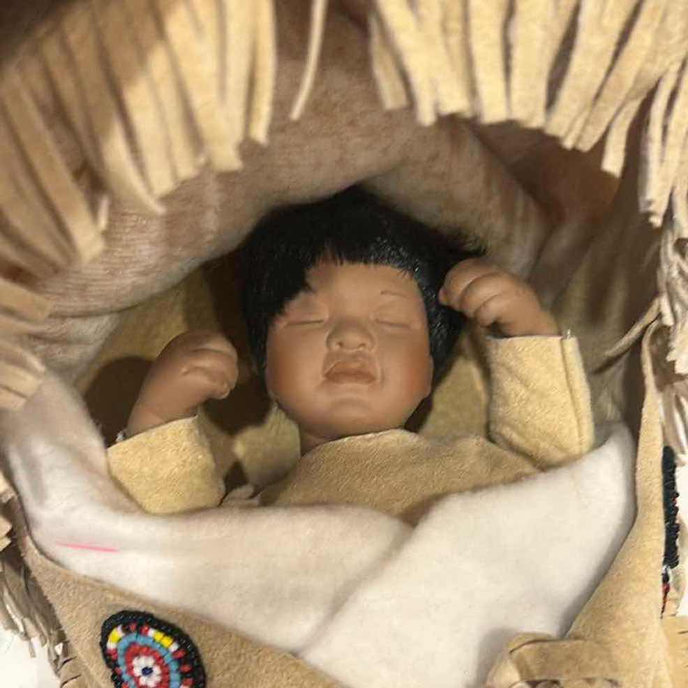 Photo 1 of VINTAGE NATIVE AMERICAN-STYLE PORCELAIN PAPOOSE BABY DOLL 
12” x H7” $60