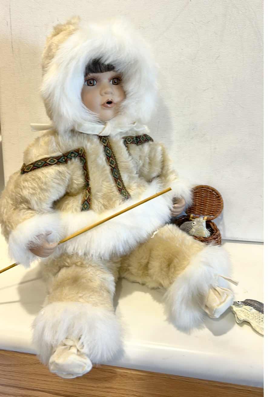 Photo 1 of VINTAGE PORCELAIN DOLL, TRADITIONAL INUIT WINTER PARKA W FISHING ROD & BASKET W FISH $60