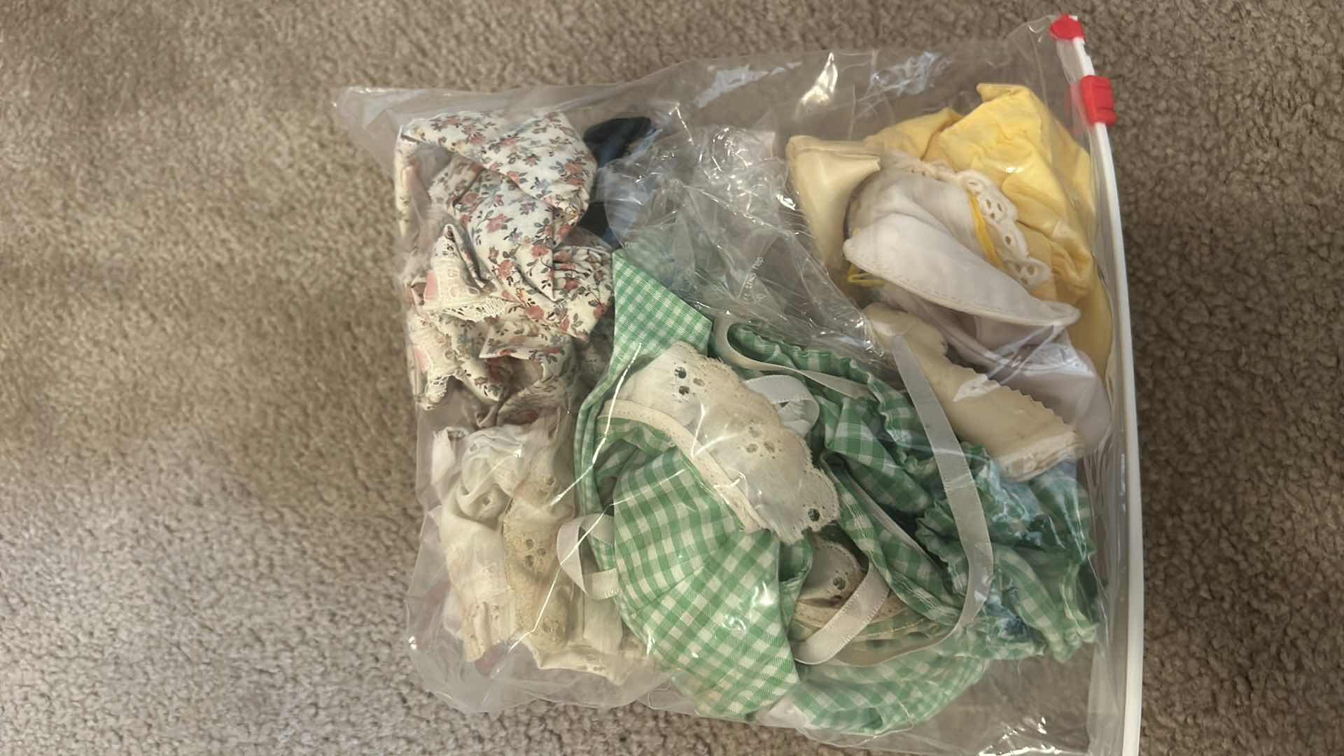 Photo 1 of BOX OF DOLL CLOTHES, AND DOLL STANDS