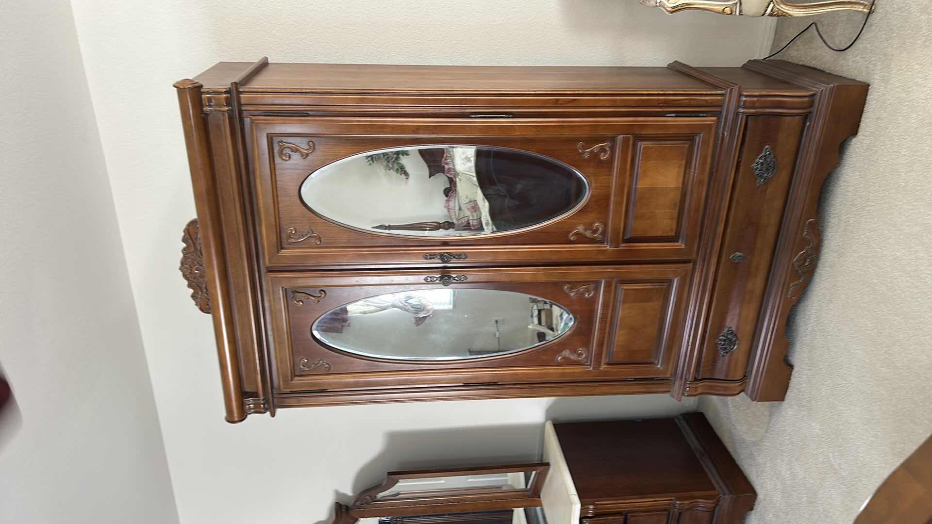 Photo 1 of STANLEY  VINTAGE STYLE, DARK WOOD ARMOIRE FEATURING OVAL MIRRORS AND INTRICATE CARVINGS. 44.5” x 19.5” x H 80”  $900