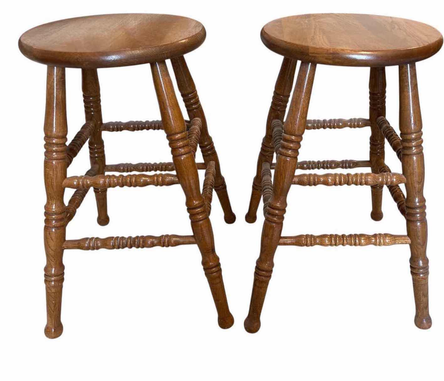Photo 1 of (2)PCS WOOD MEDIUM OAK BAR STOOLS WITH ROUND SEATS, TURNED LEGS, AND FOOTRESTS H24” $300