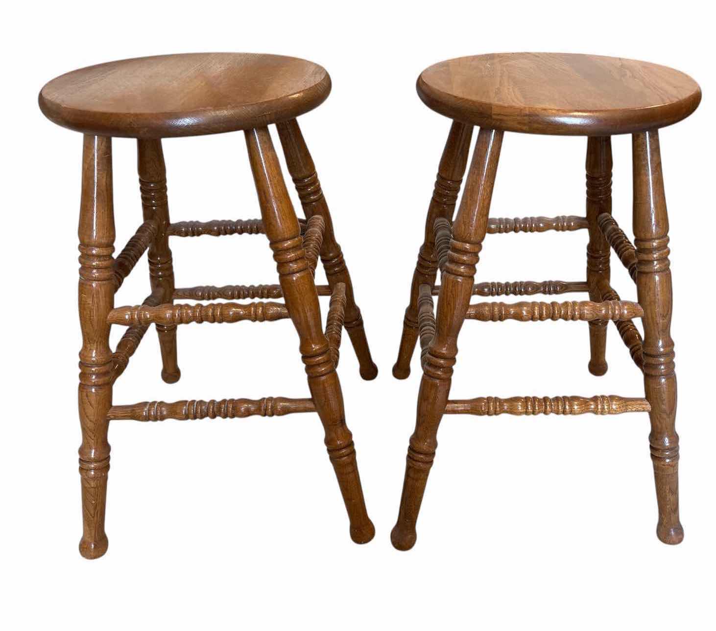 Photo 1 of (2)PCS WOOD MEDIUM OAK BAR STOOLS WITH ROUND SEATS, TURNED LEGS, AND FOOTRESTS H24” $300