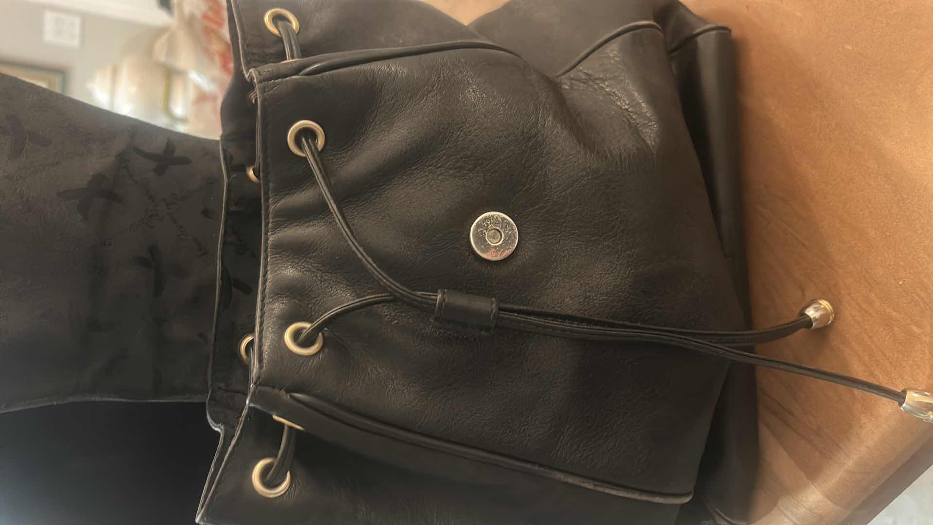 Photo 1 of VINTAGE PALOMA PICASSO BLACK LEATHER DRAWSTRING BACKPACK FEATURES A SLOUCHY BUCKET SILHOUETTE CRAFTED FROM GLOVE-SOFT SMOOTH BLACK LEATHER. EST VALUE $125 - $200