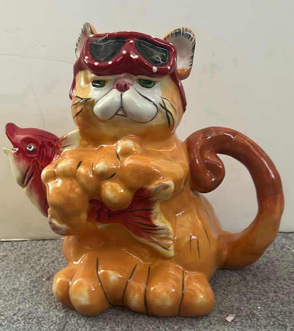 View 1 of BLUE SKY CLAYWORKS “CATCHING A FISH” CAT TEAPOT H9”