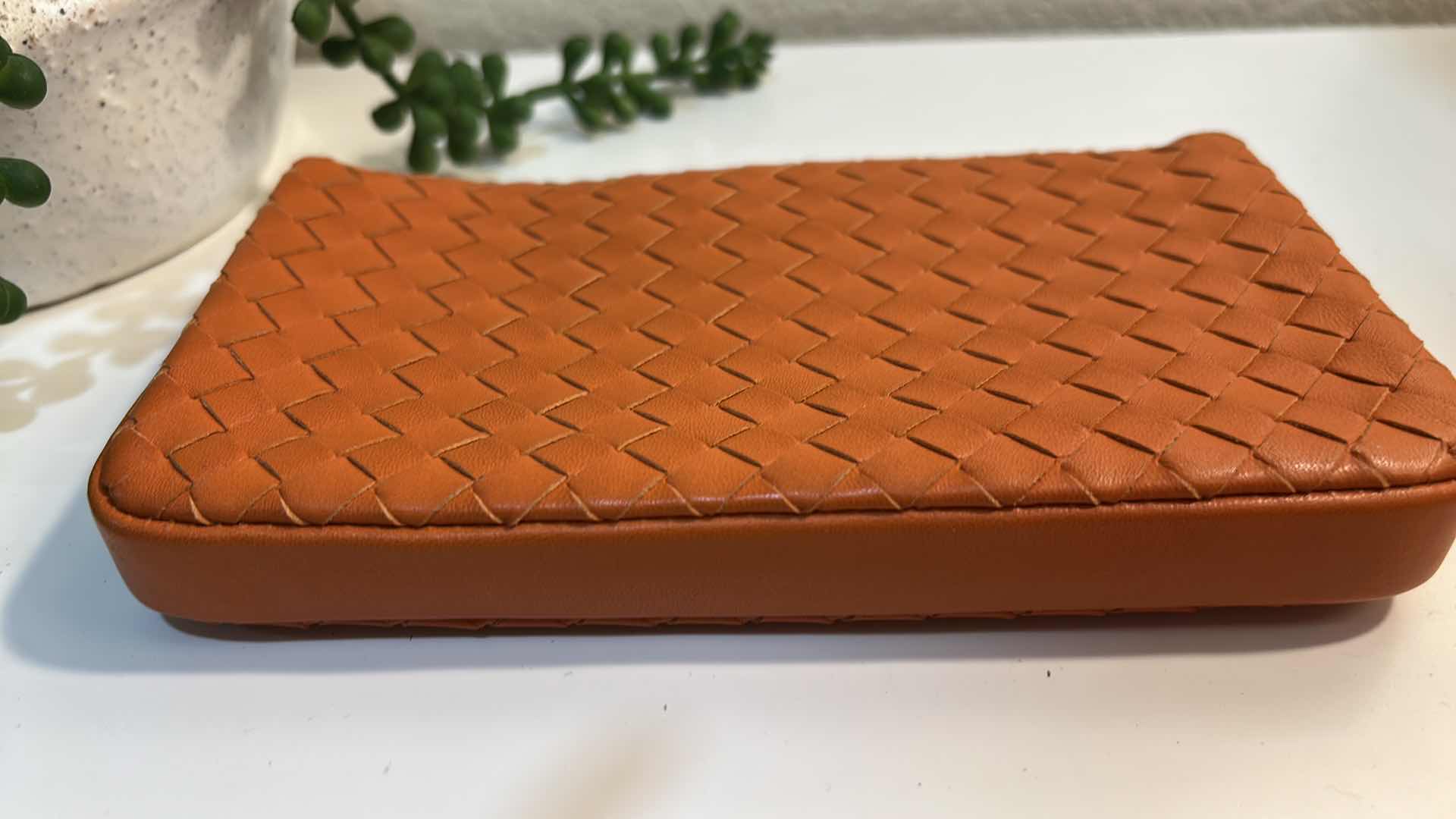 Photo 1 of BOTTEGA VENETA: VINTAGE ORANGE INTRECCIATO LEATHER TURN-LOCK CLUTCH BAG
