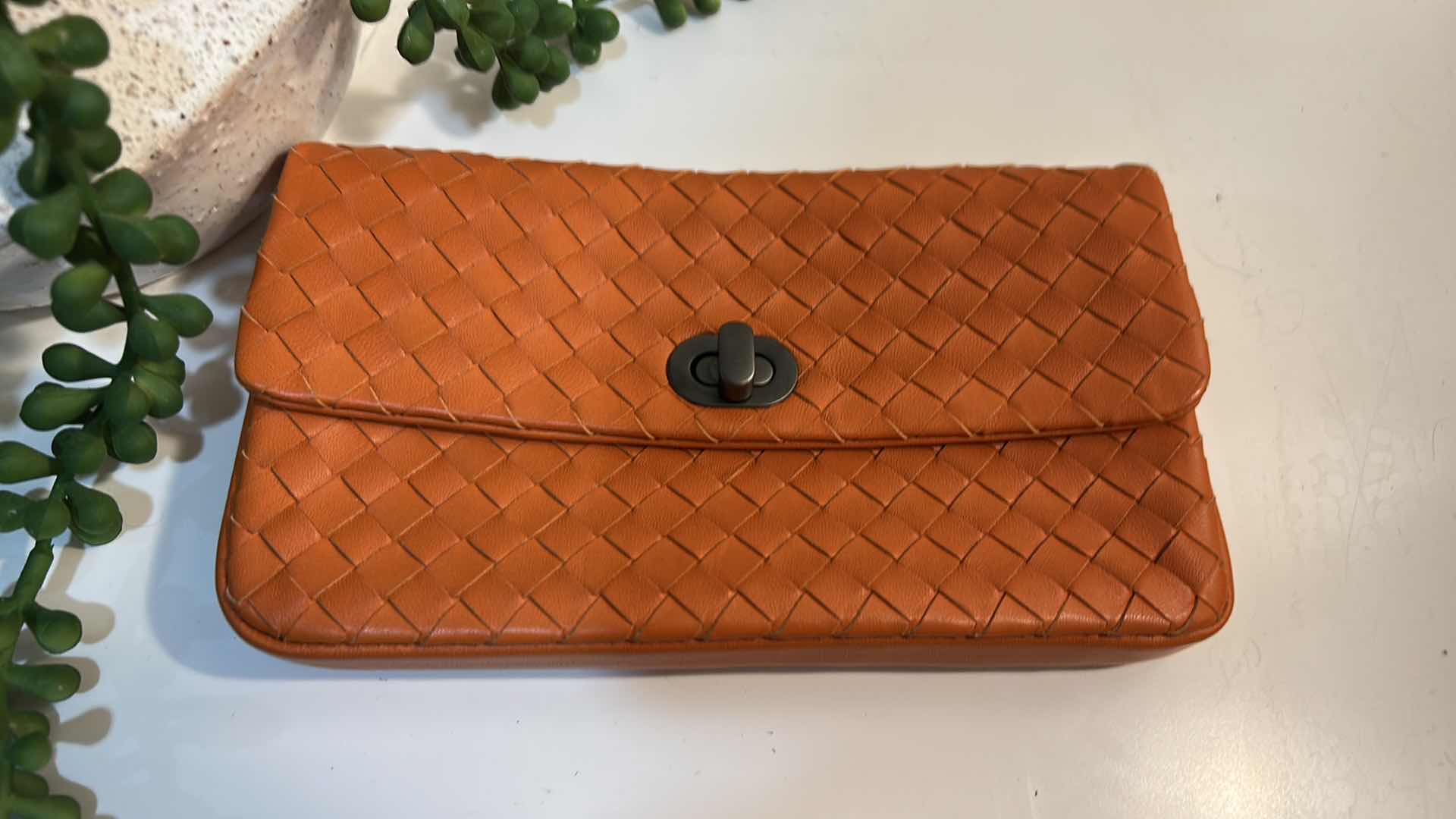 Photo 1 of BOTTEGA VENETA: VINTAGE ORANGE INTRECCIATO LEATHER TURN-LOCK CLUTCH BAG