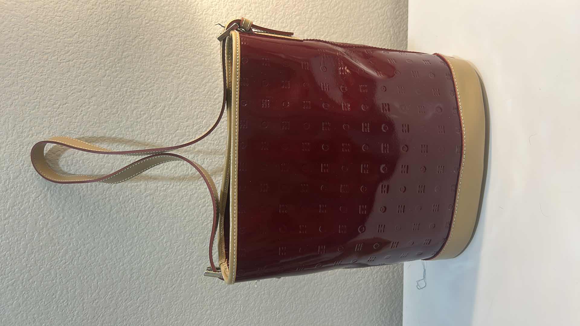 Photo 1 of ARCADIA BURGUNDY EMBOSSED MONOGRAM PATENT LEATHER BUCKET BAG