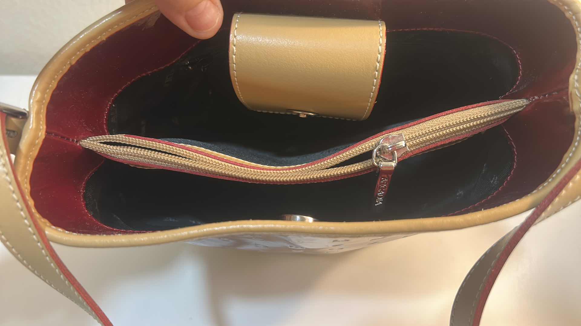 Photo 1 of ARCADIA BURGUNDY EMBOSSED MONOGRAM PATENT LEATHER BUCKET BAG