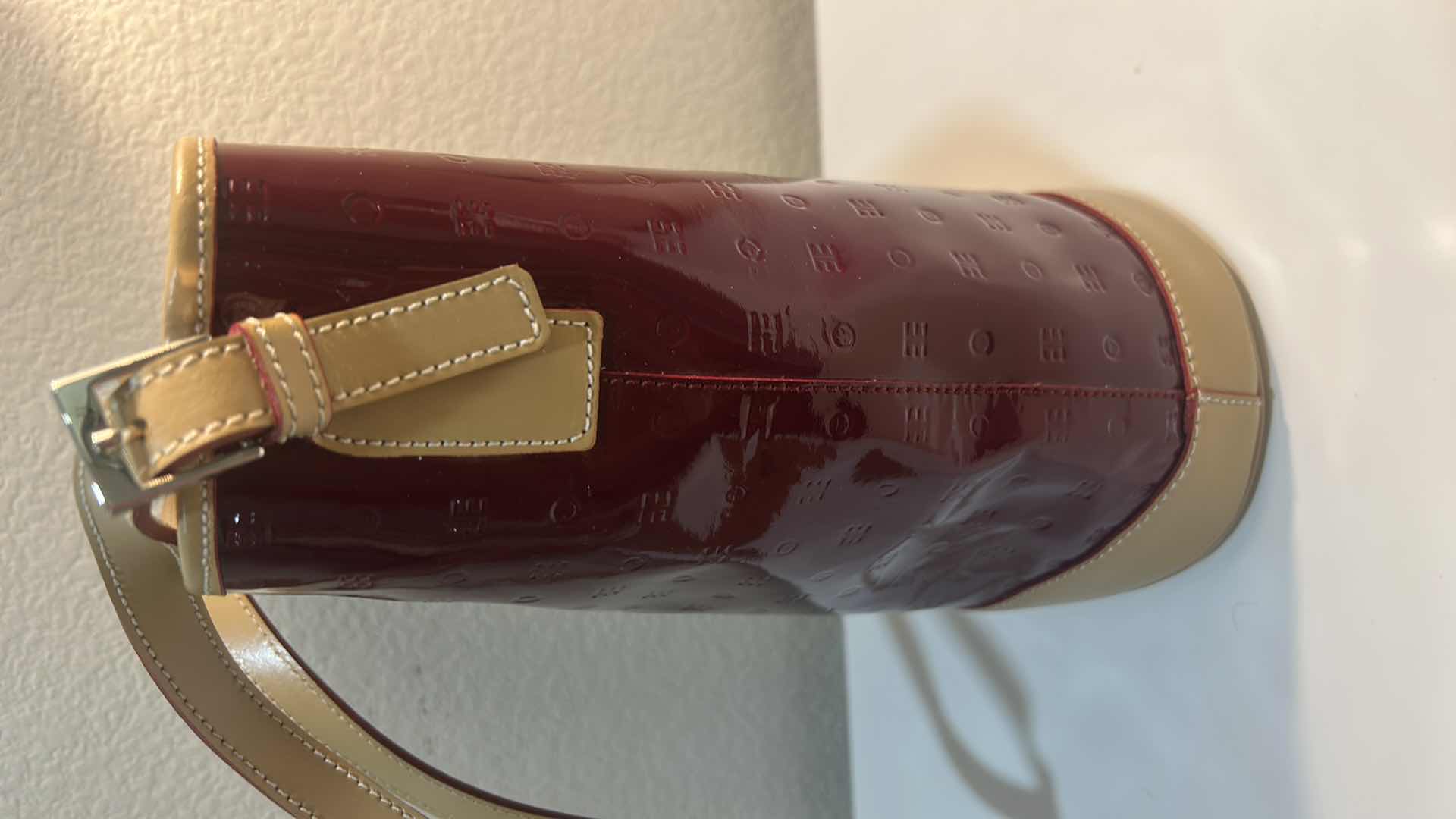 Photo 1 of ARCADIA BURGUNDY EMBOSSED MONOGRAM PATENT LEATHER BUCKET BAG