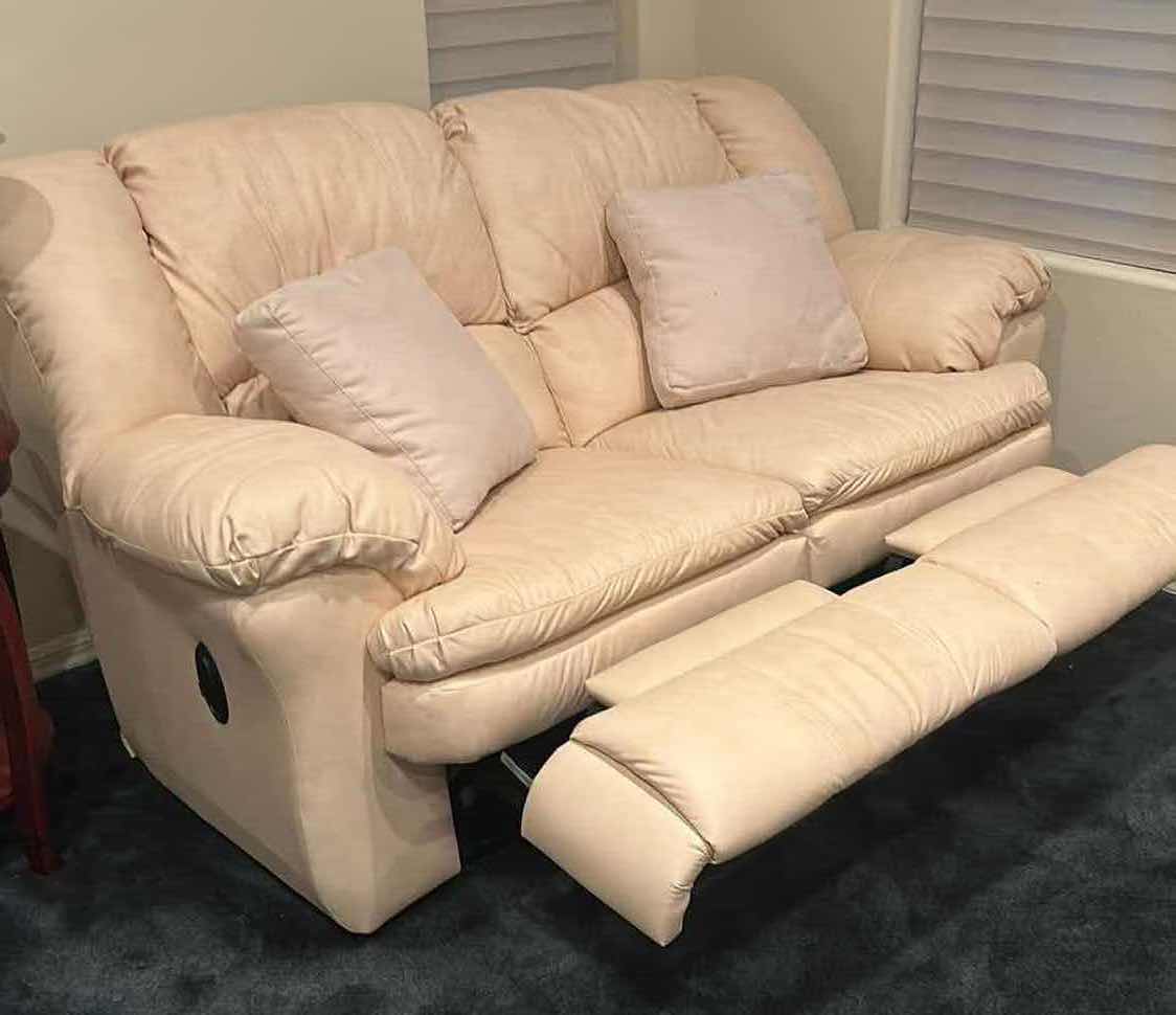 Photo 1 of OFF WHITE LEATHER RECLINING LOVESEAT W COMFORTABLE PADDED CUSHIONS W DIAGONAL SEAM DETAIL 2 ACCENT PILLOWS