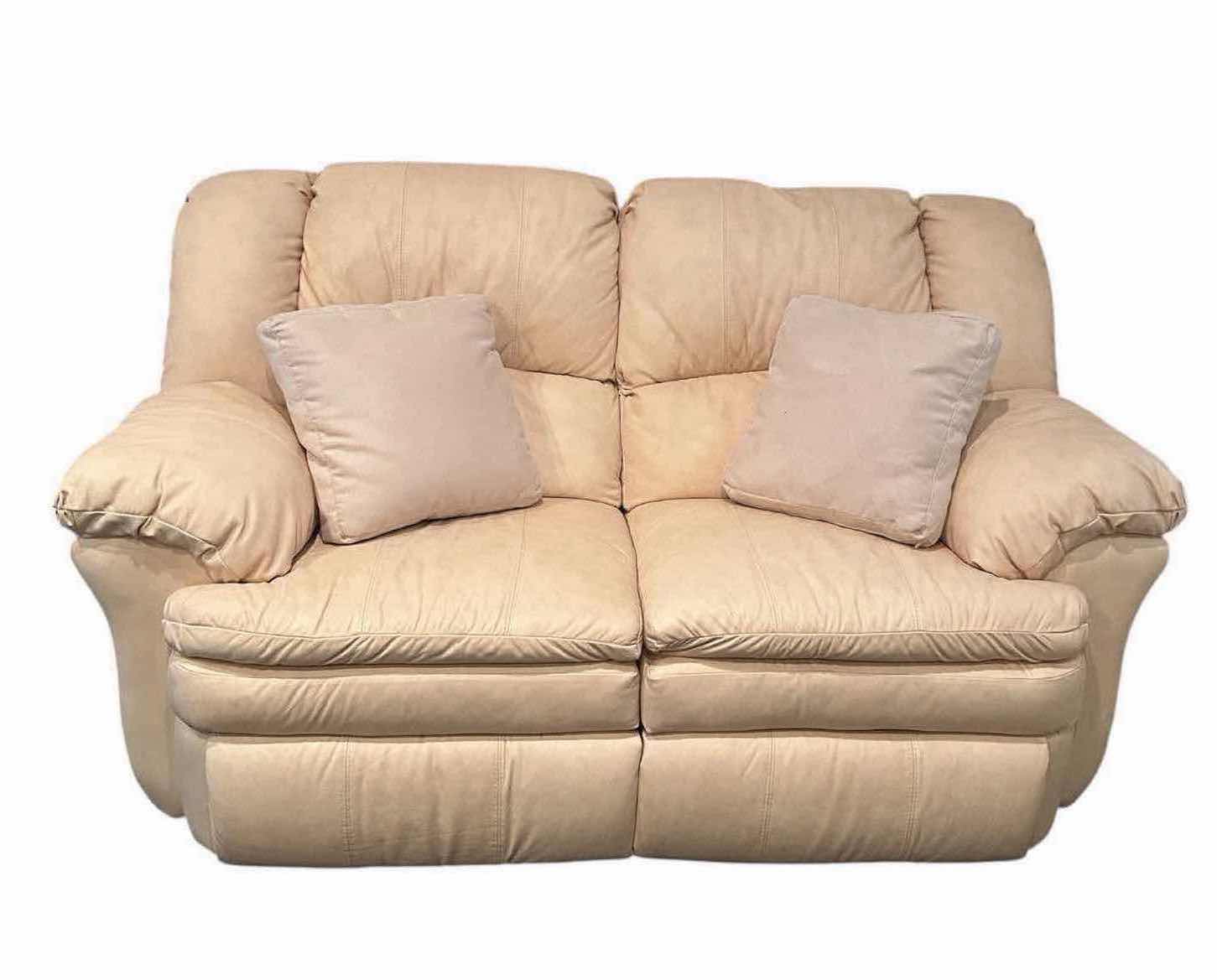 Photo 1 of OFF WHITE LEATHER RECLINING LOVESEAT W COMFORTABLE PADDED CUSHIONS W DIAGONAL SEAM DETAIL 2 ACCENT PILLOWS
